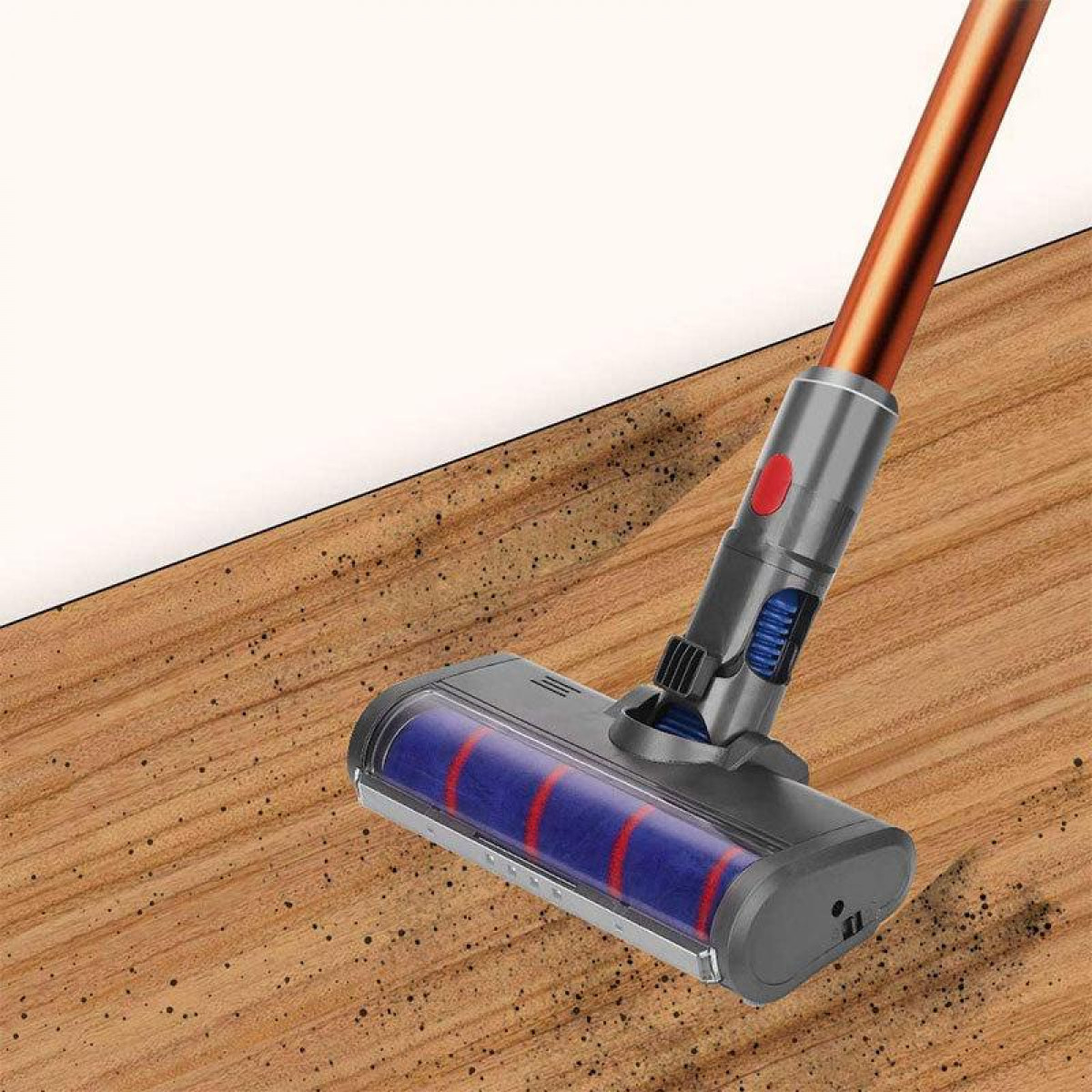 Ein kabelloser Staubsauger wird auf einem Holzboden verwendet. Auf dem Boden sind Ablagerungen sichtbar.