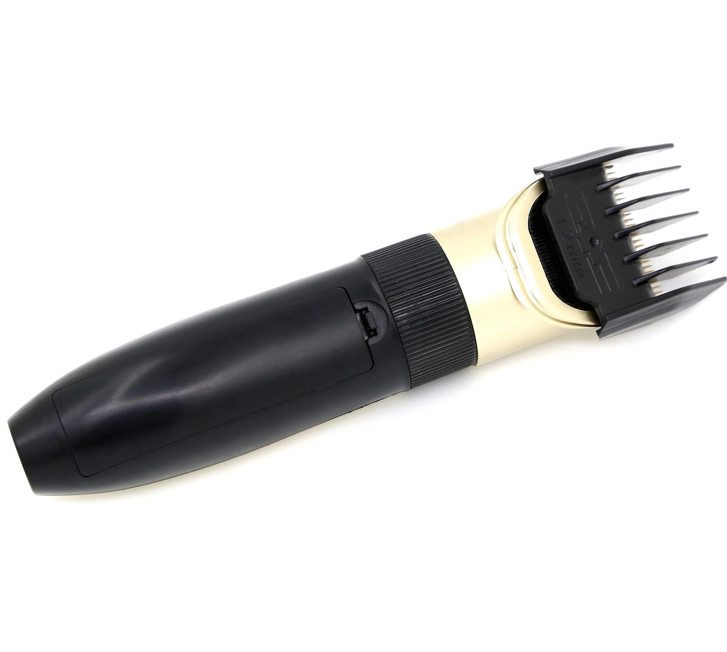 Czarno-złota trymer do brody na białej powierzchni.