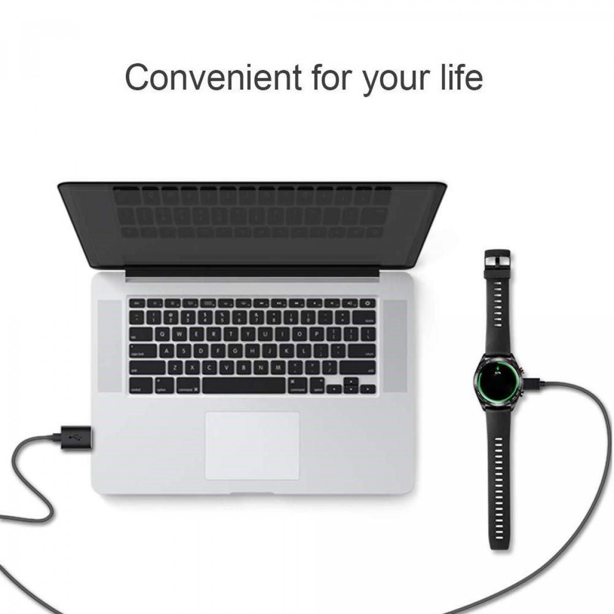 Laptop mit Smartwatch über Ladekabel verbunden. Schwarz und Silber.