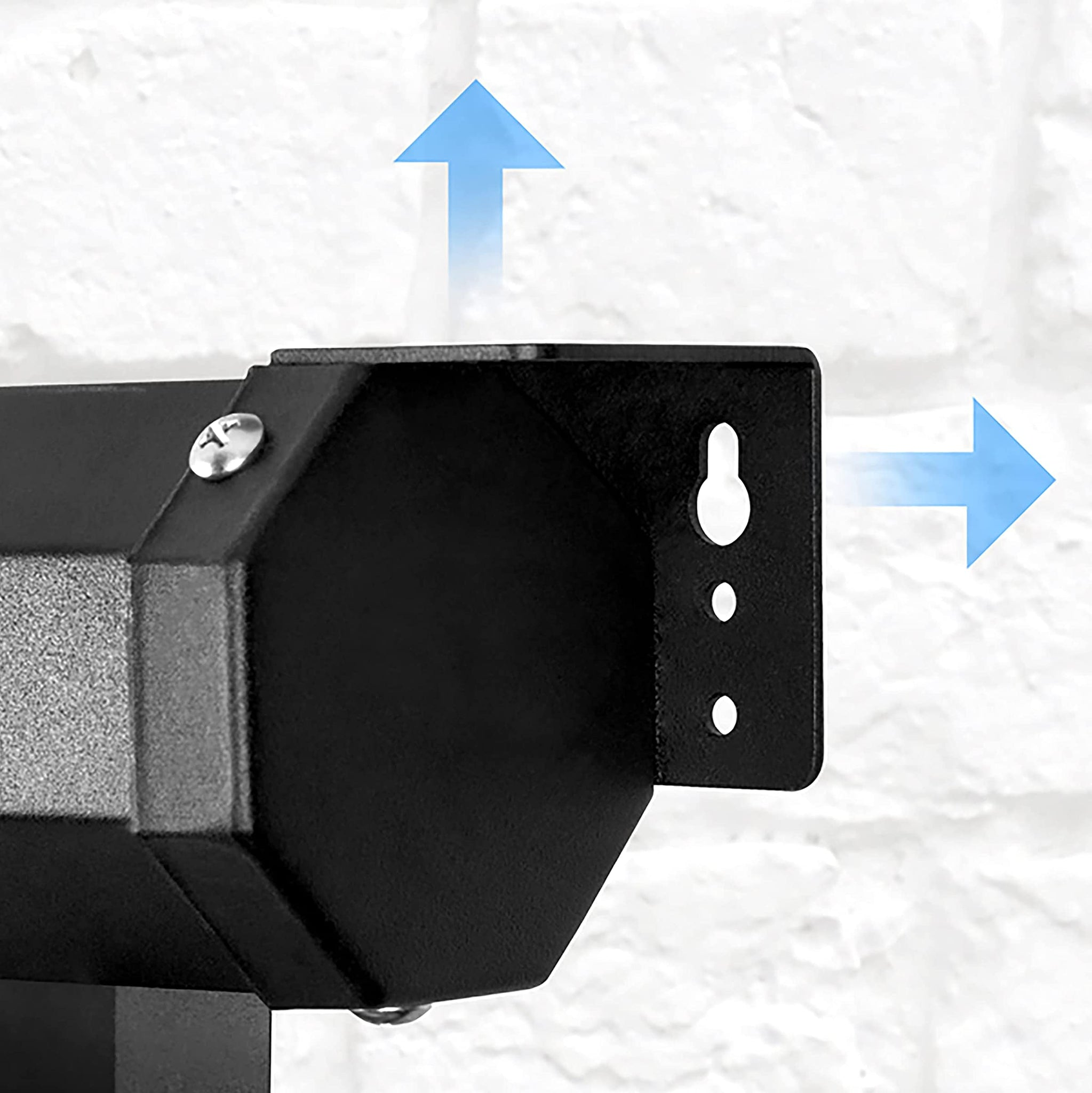 Soporte metálico negro en una pared de ladrillos blancos. Flechas indican direcciones hacia arriba y hacia la derecha.