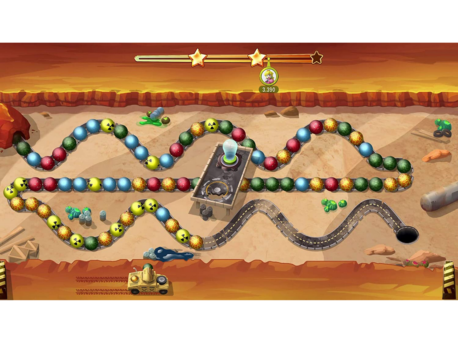Scena z gry z kulkami, przeszkodami i czołgiem. Na górze widoczne są gwiazdki i wynik.