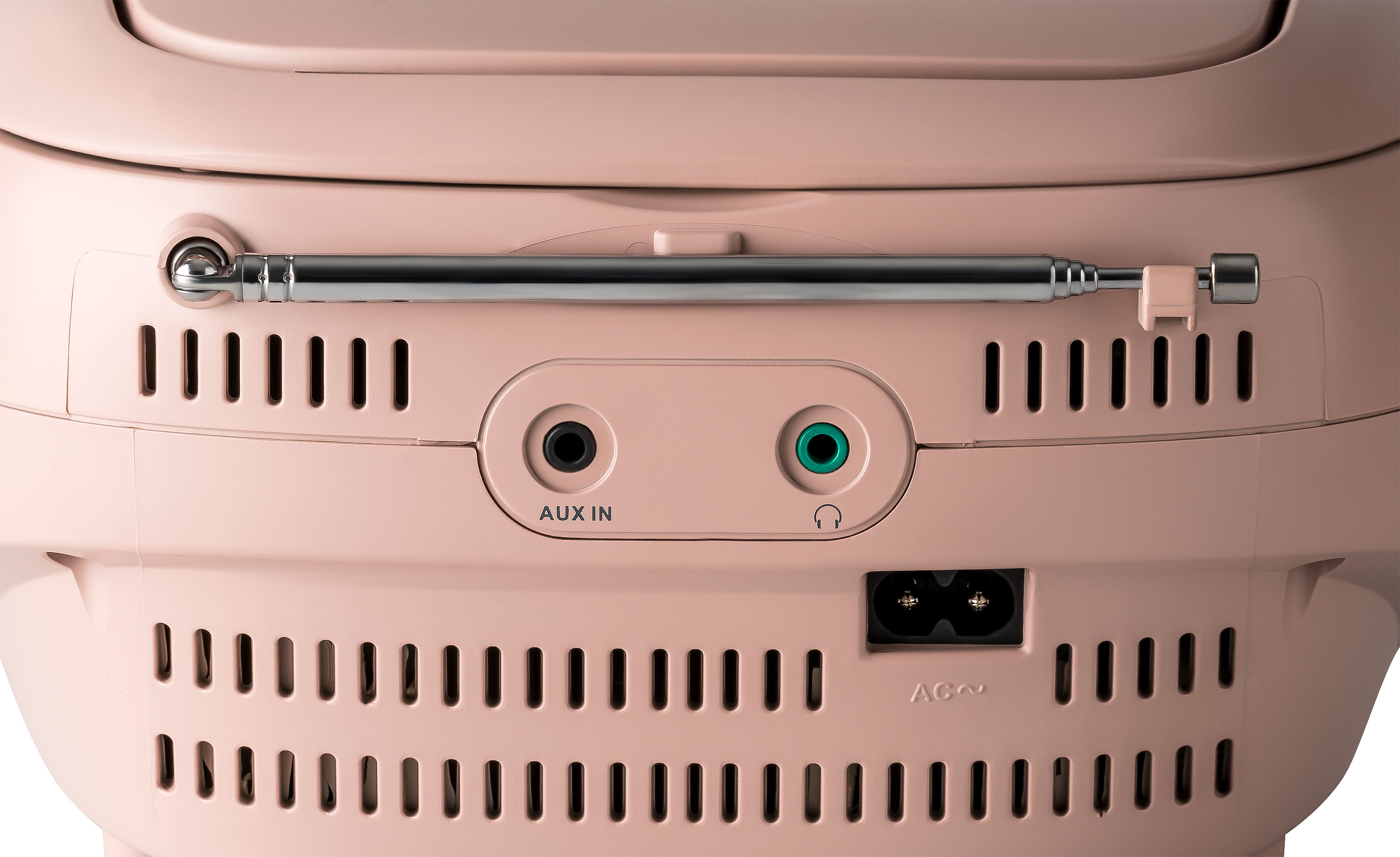 Nahaufnahme der Rückseite eines rosa Retro-Radios. Enthält Anschlüsse, Lüftungsschlitze und eine ausziehbare Antenne.