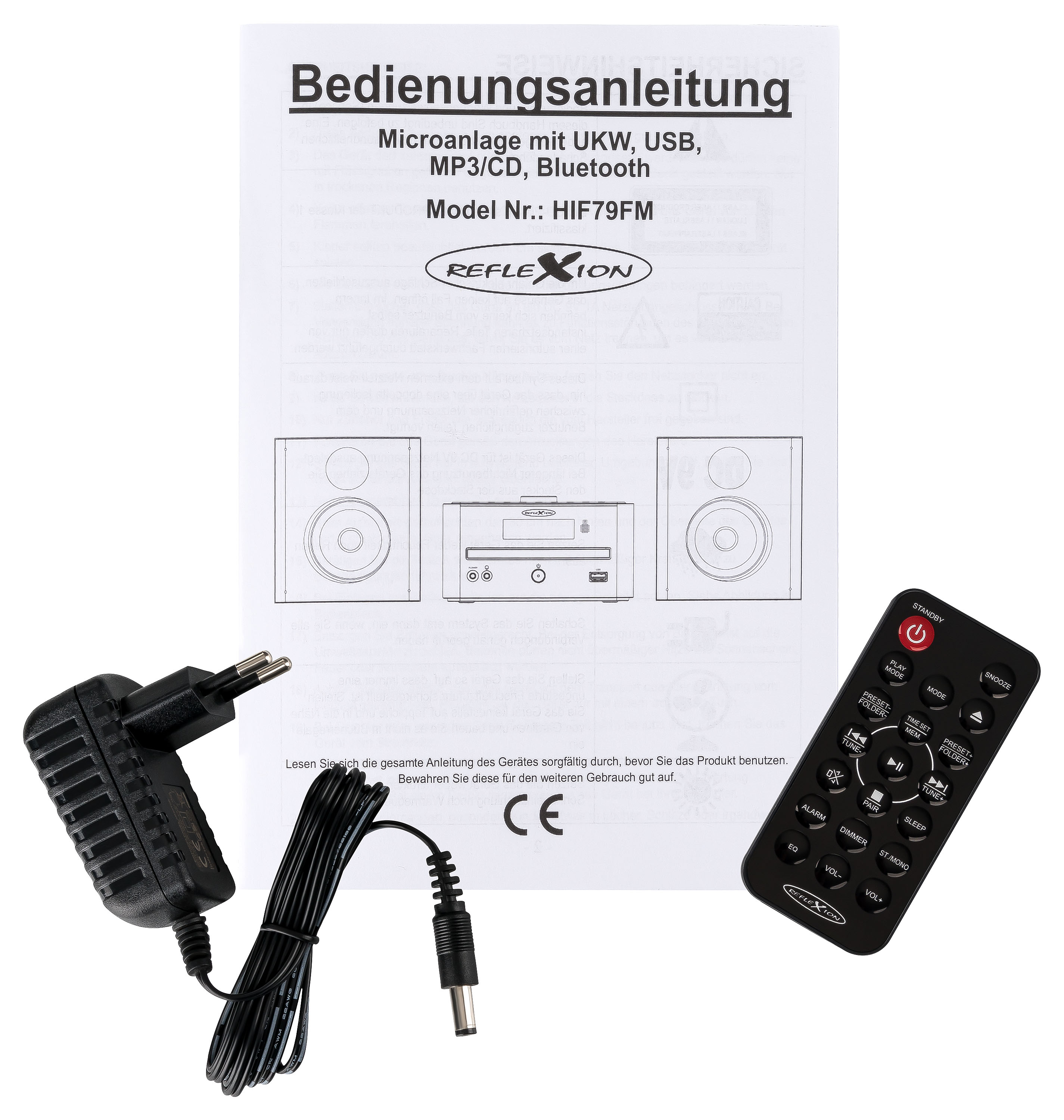 Handbuch, Lautsprecher, Netzteil und Fernbedienung eines Stereo-Systems auf weißem Hintergrund.