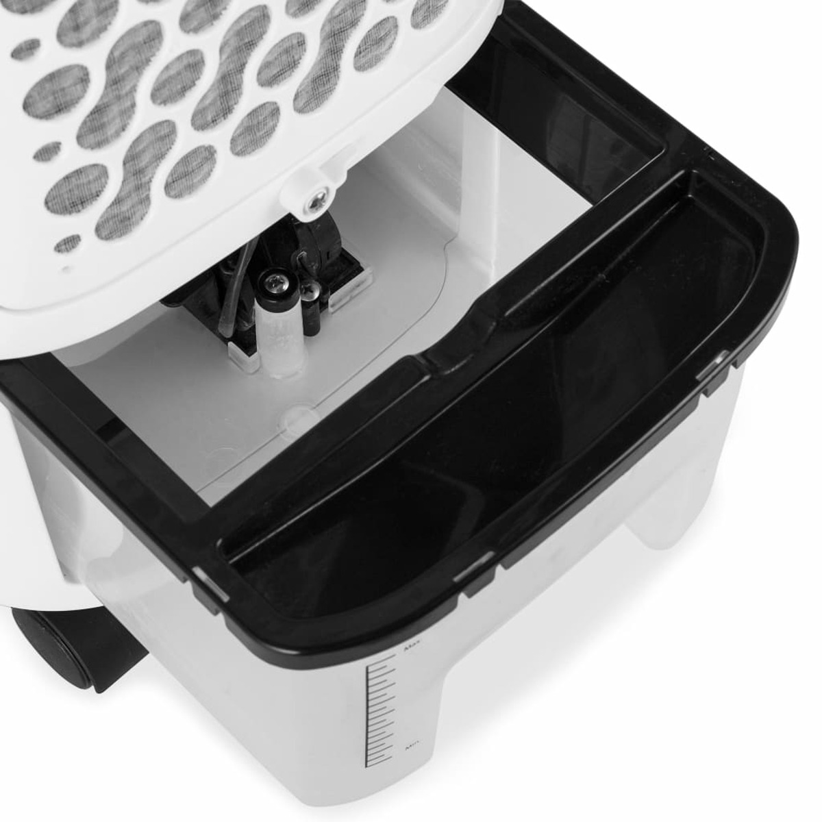 Zbliżenie na białą chłodziarkę powietrza; otwarta górna pokrywa, pokazująca elementy wewnętrzne i czarną tacę.