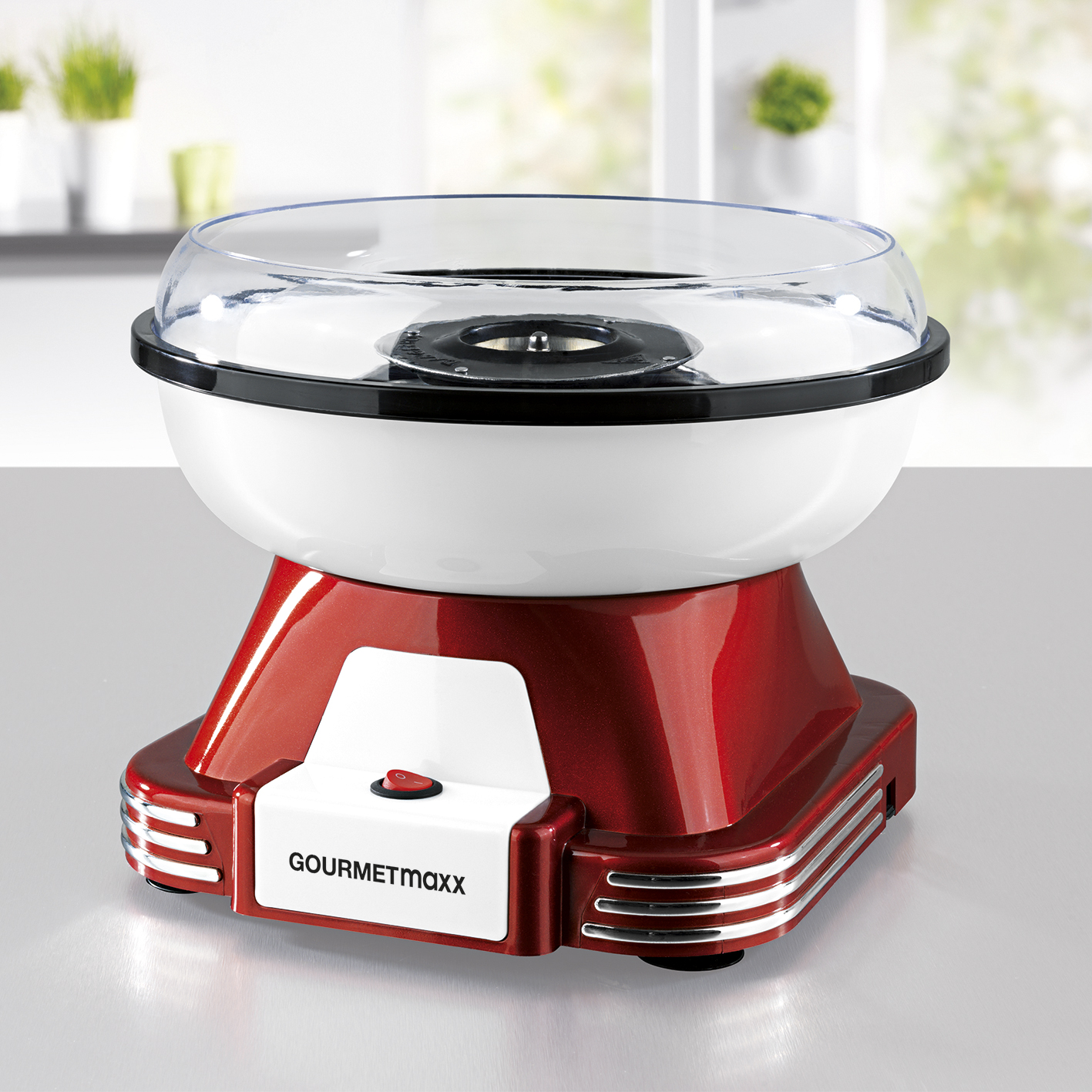 Ein rot-weißer Zuckerwattemaschine.
