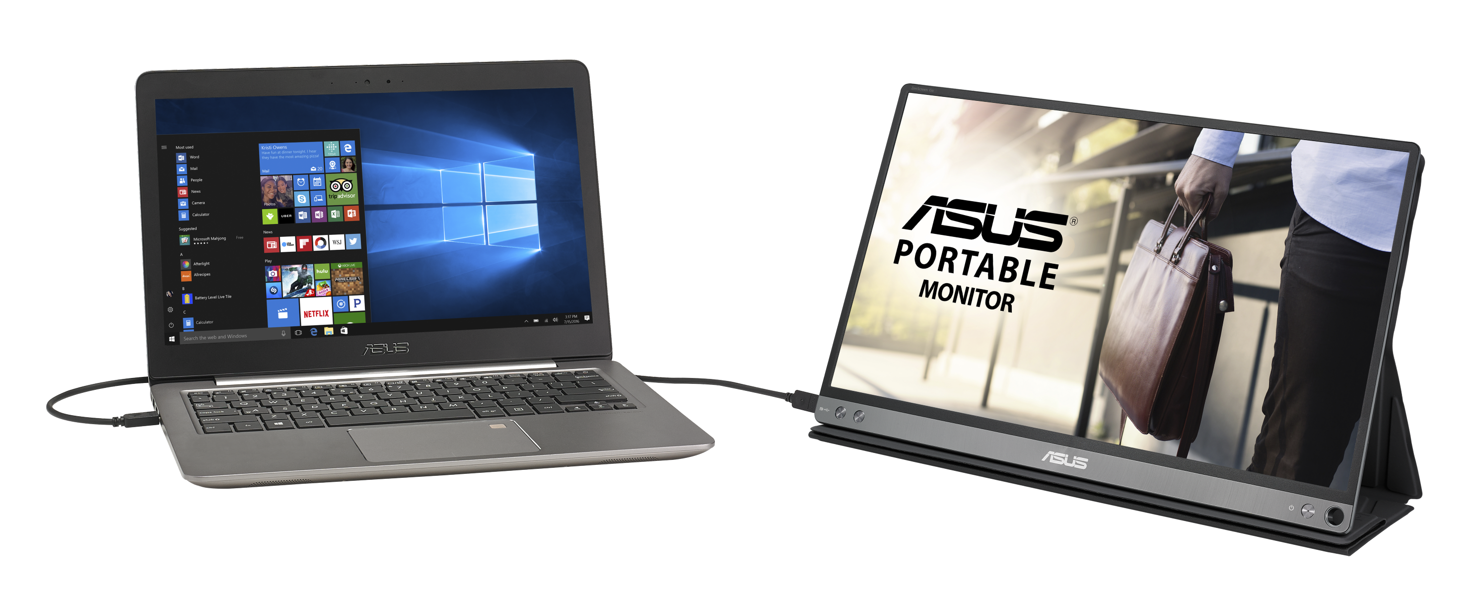 Laptop con schermo Windows accanto a un monitor portatile con logo ASUS e una persona.
