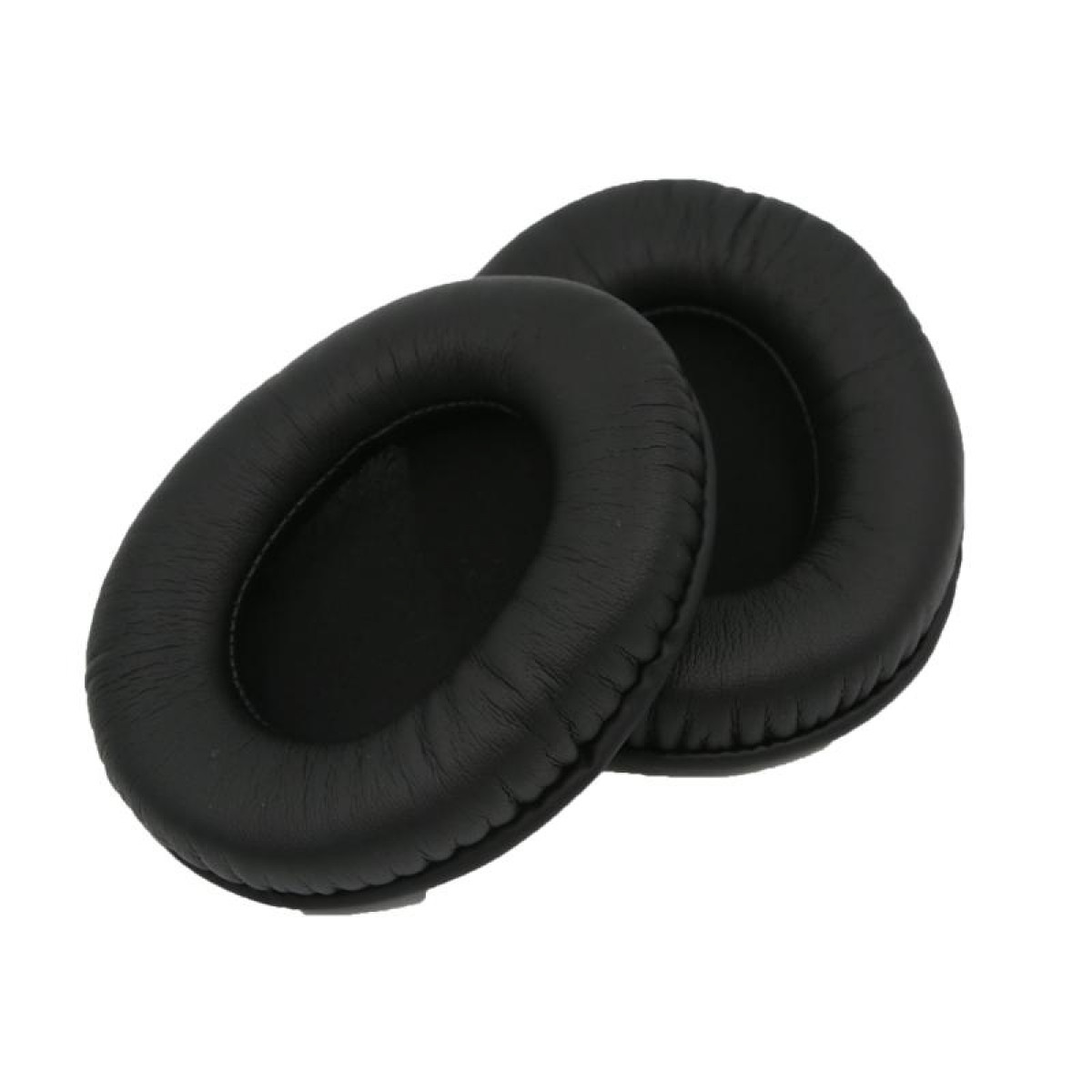 Par de almohadillas para auriculares negras, de forma ovalada, aisladas sobre un fondo blanco.