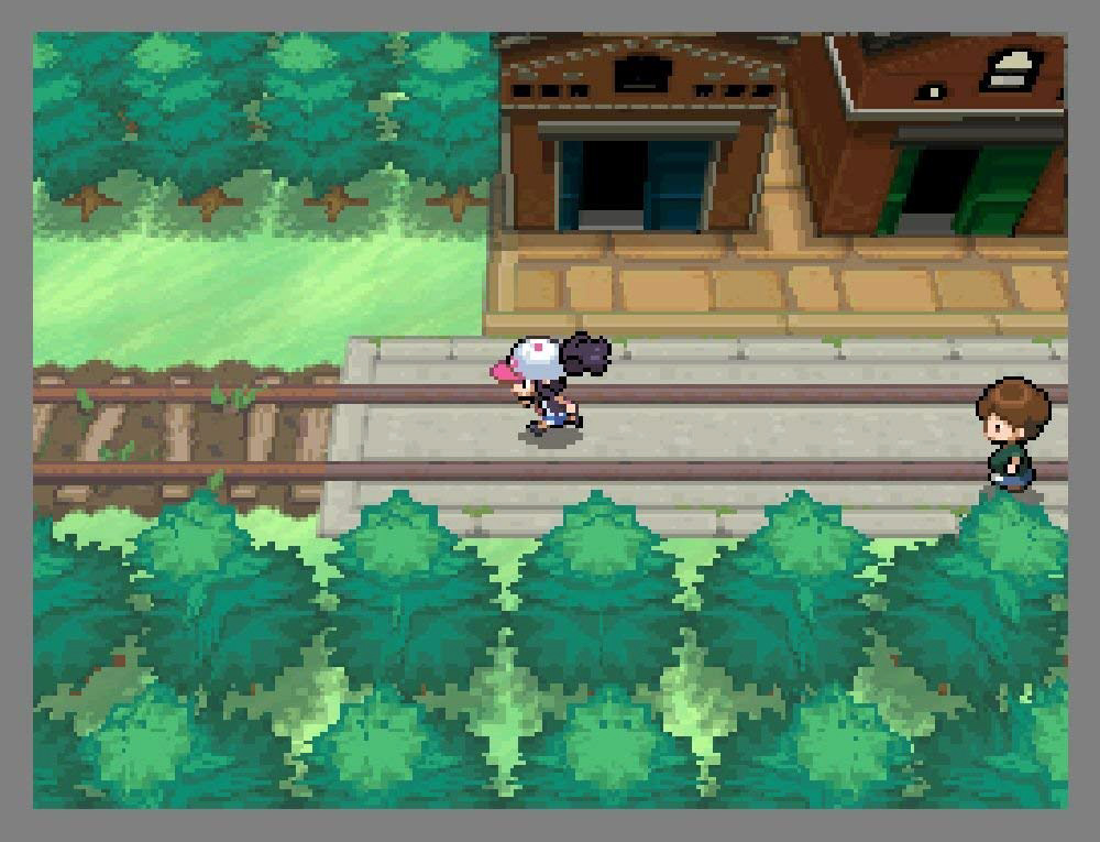 Ein verpixeltes Bild einer Videospielszene. Eine Person und eine andere Person gehen einen Weg entlang mit Gebäuden.