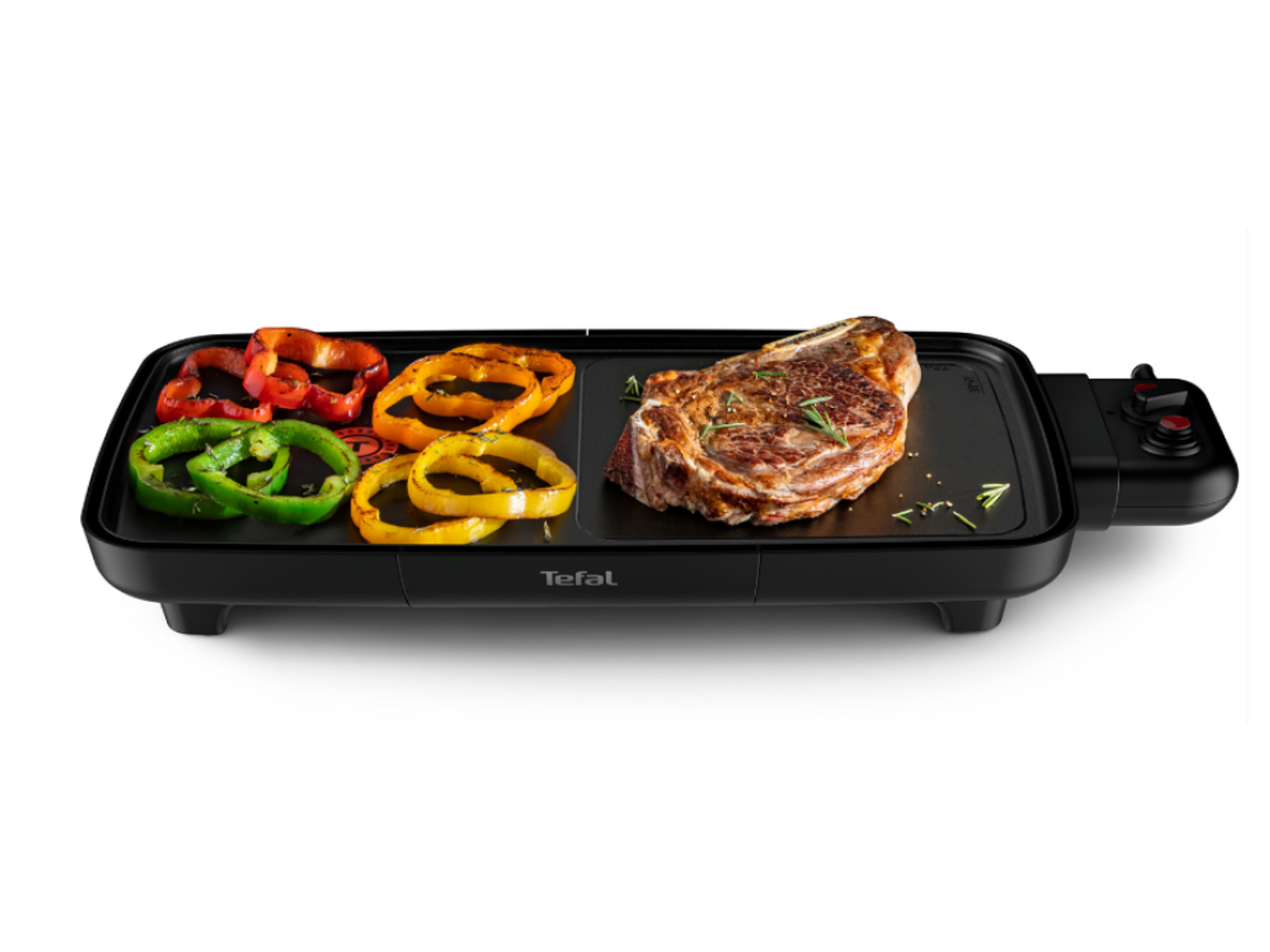 Parrilla eléctrica negra con bistec, pimientos coloridos. Logotipo Tefal al frente. Fondo negro.
