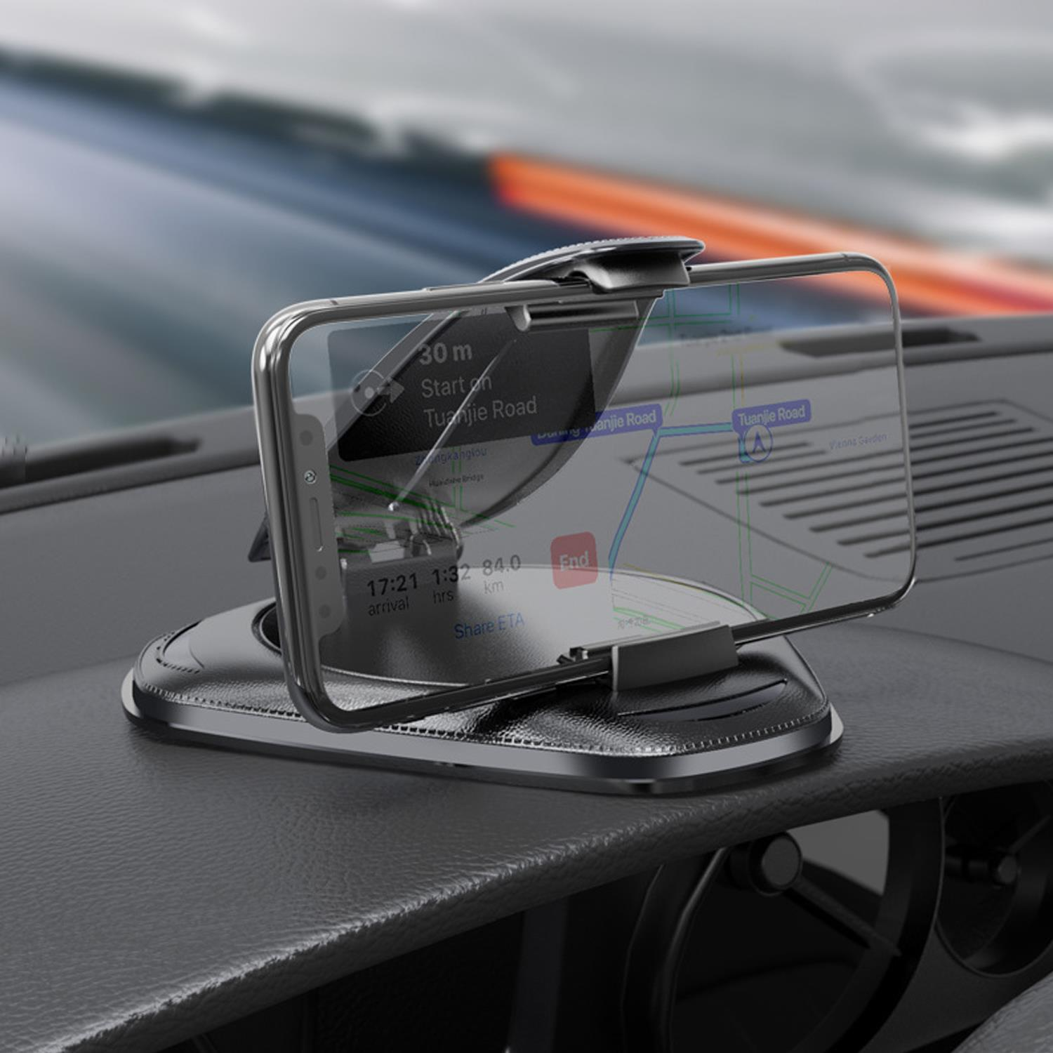 Un cruscotto di un'auto con un telefono che mostra un'app di navigazione. Il telefono è in un supporto.