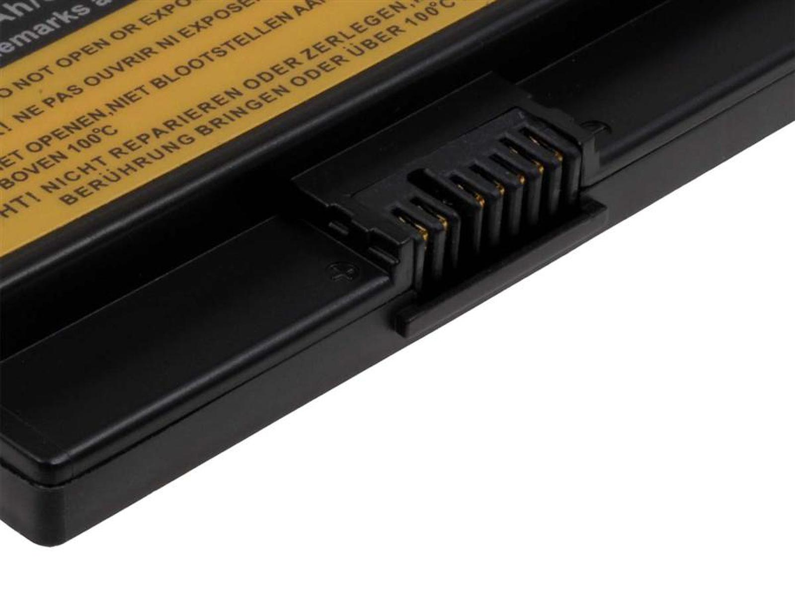 Schwarzer Batterieanschluss mit Goldkontakten, mit Text oben.