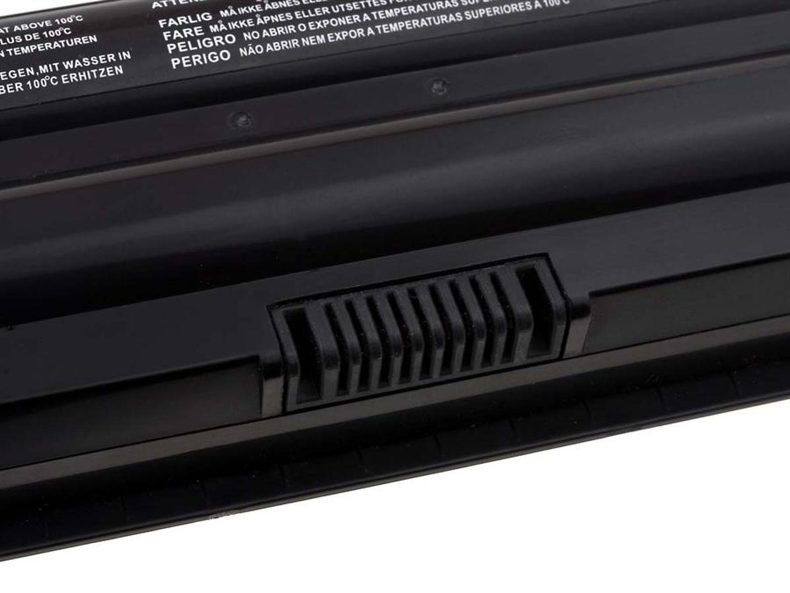 Primer plano de una batería negra de portátil que muestra las rejillas de ventilación y un mecanismo de bloqueo.