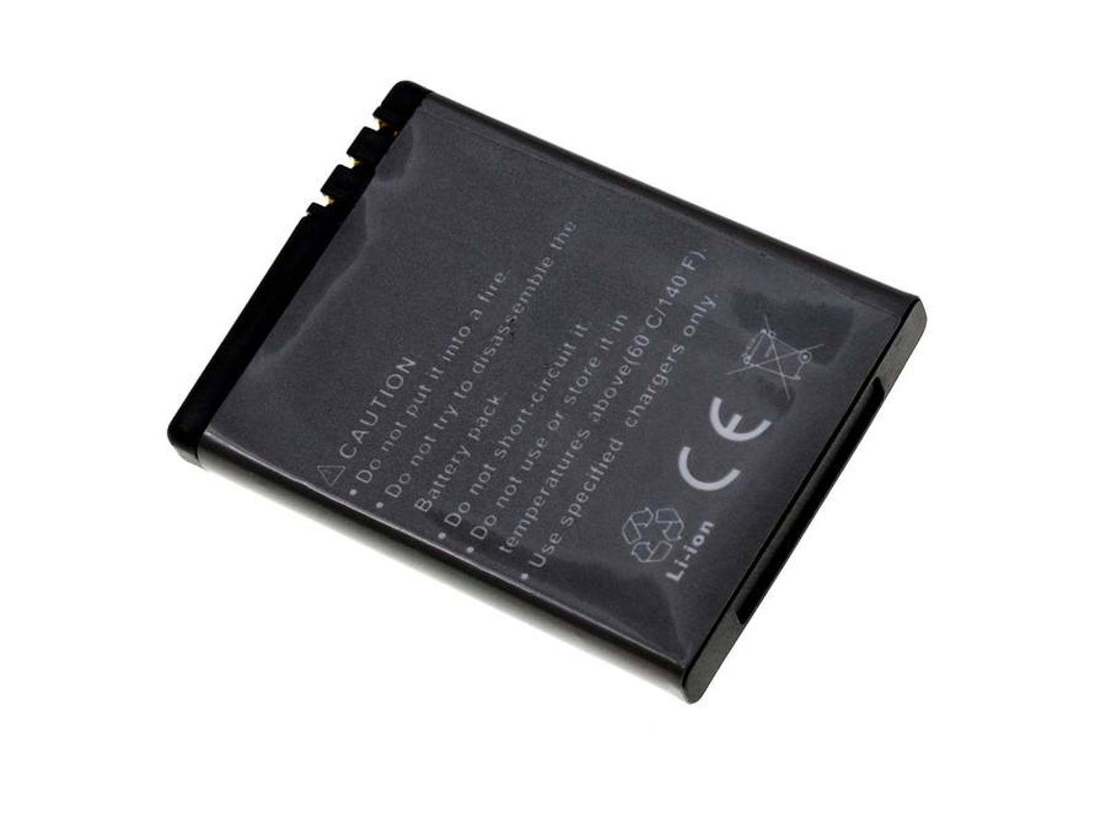 Una batería rectangular negra con advertencias de seguridad. La batería está sobre una superficie blanca.