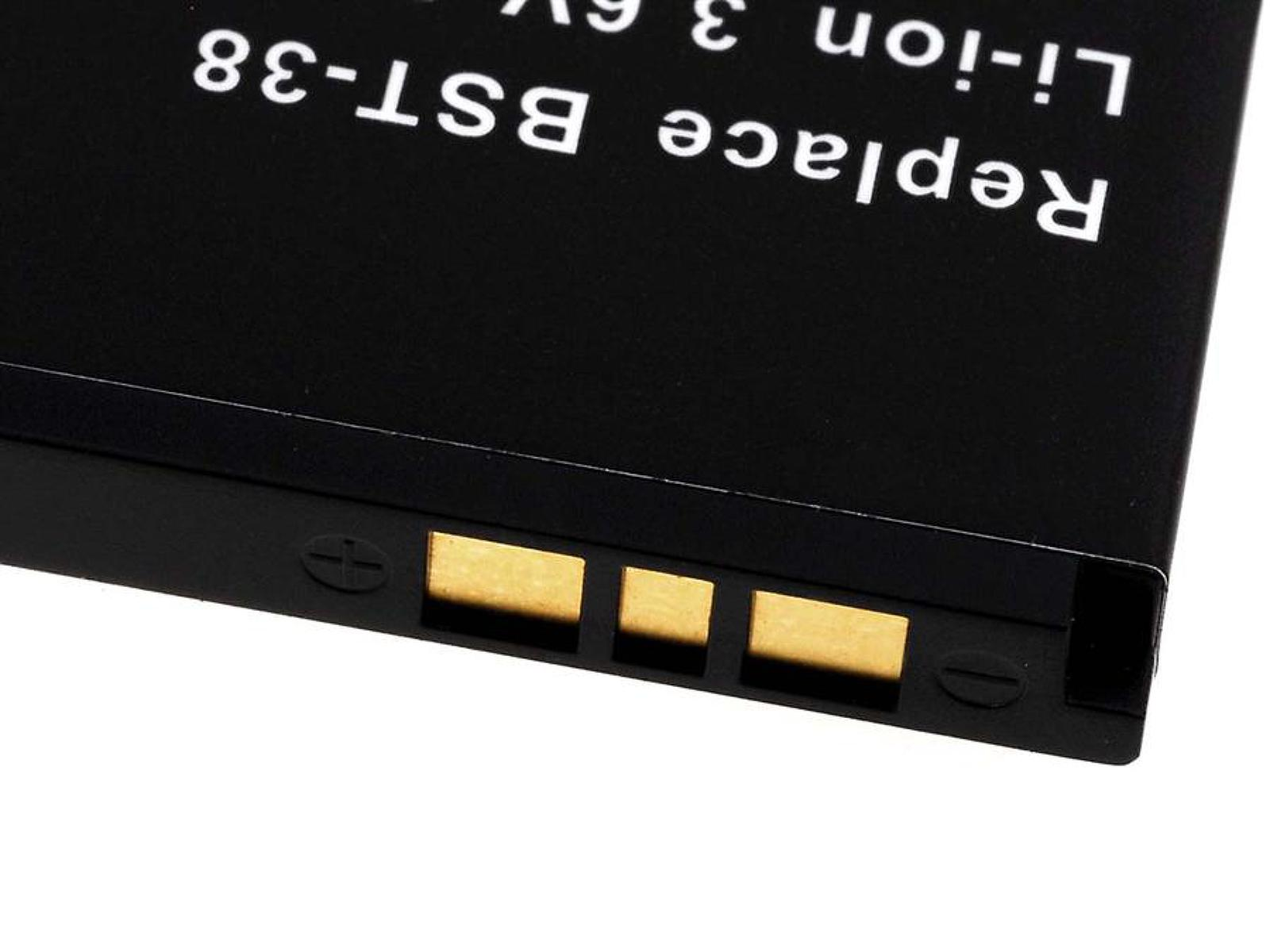 Batería negra con texto blanco 'Replace BST-38 Li-ion 3.6V'. El fondo es blanco.