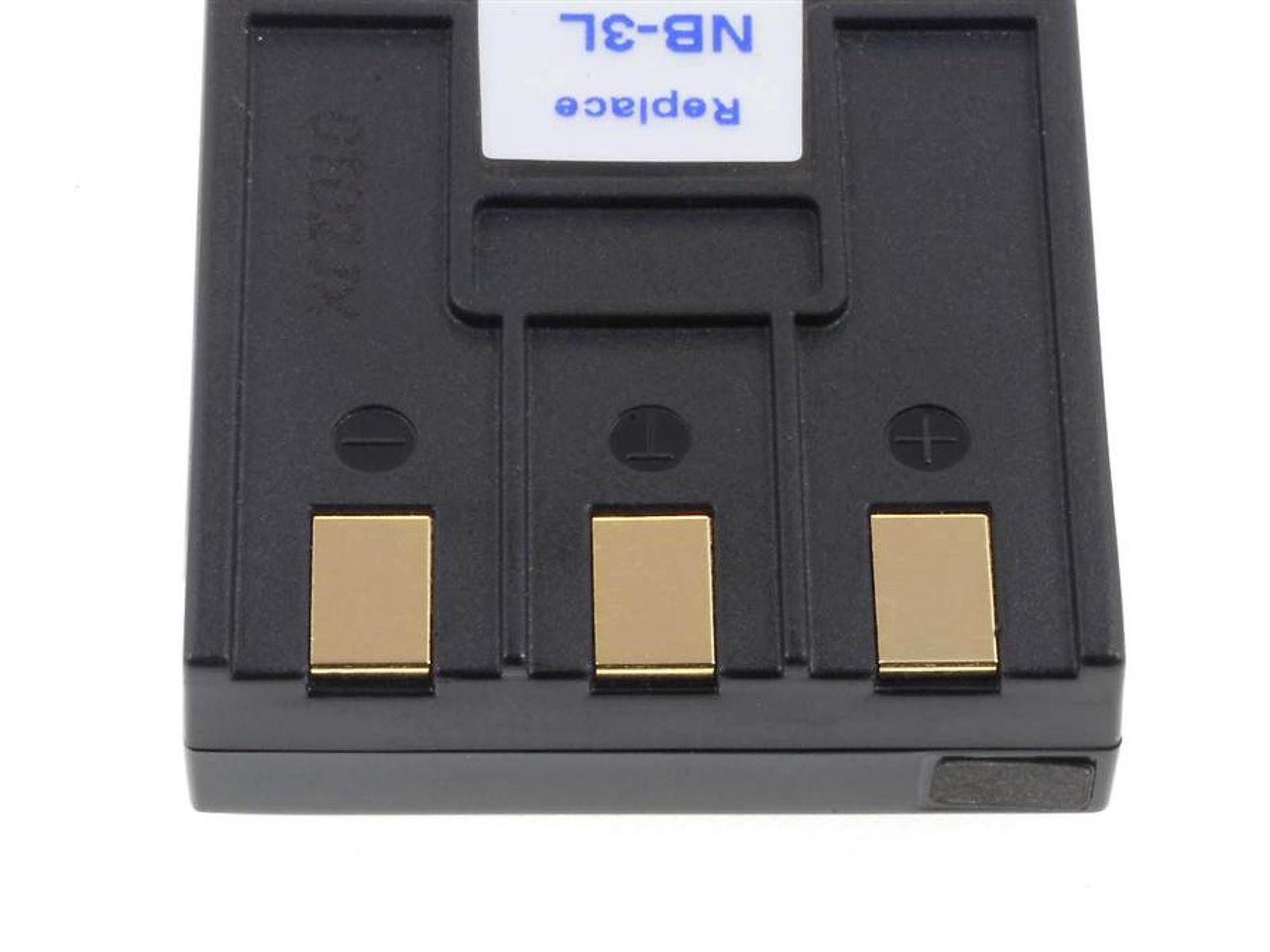 Batería negra con etiqueta blanca y puntos de contacto dorados. La etiqueta dice NB-3L Replace.