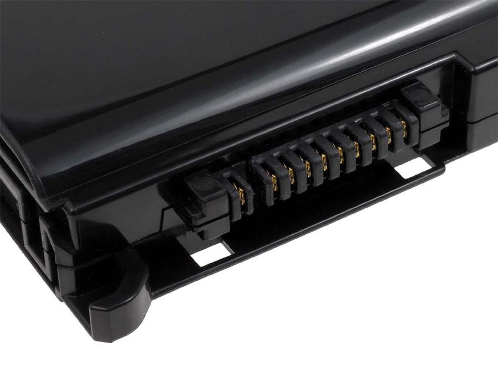 Primer plano de una batería negra de portátil, mostrando los pines del conector.