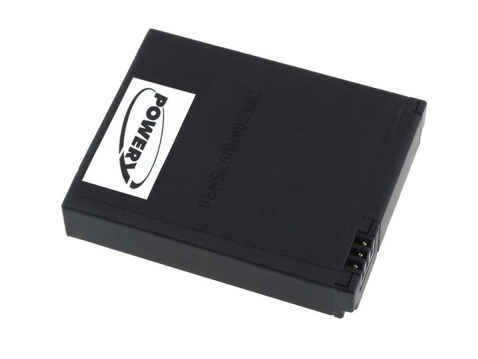 Batería negra con pegatina blanca. Forma rectangular, plástico negro.