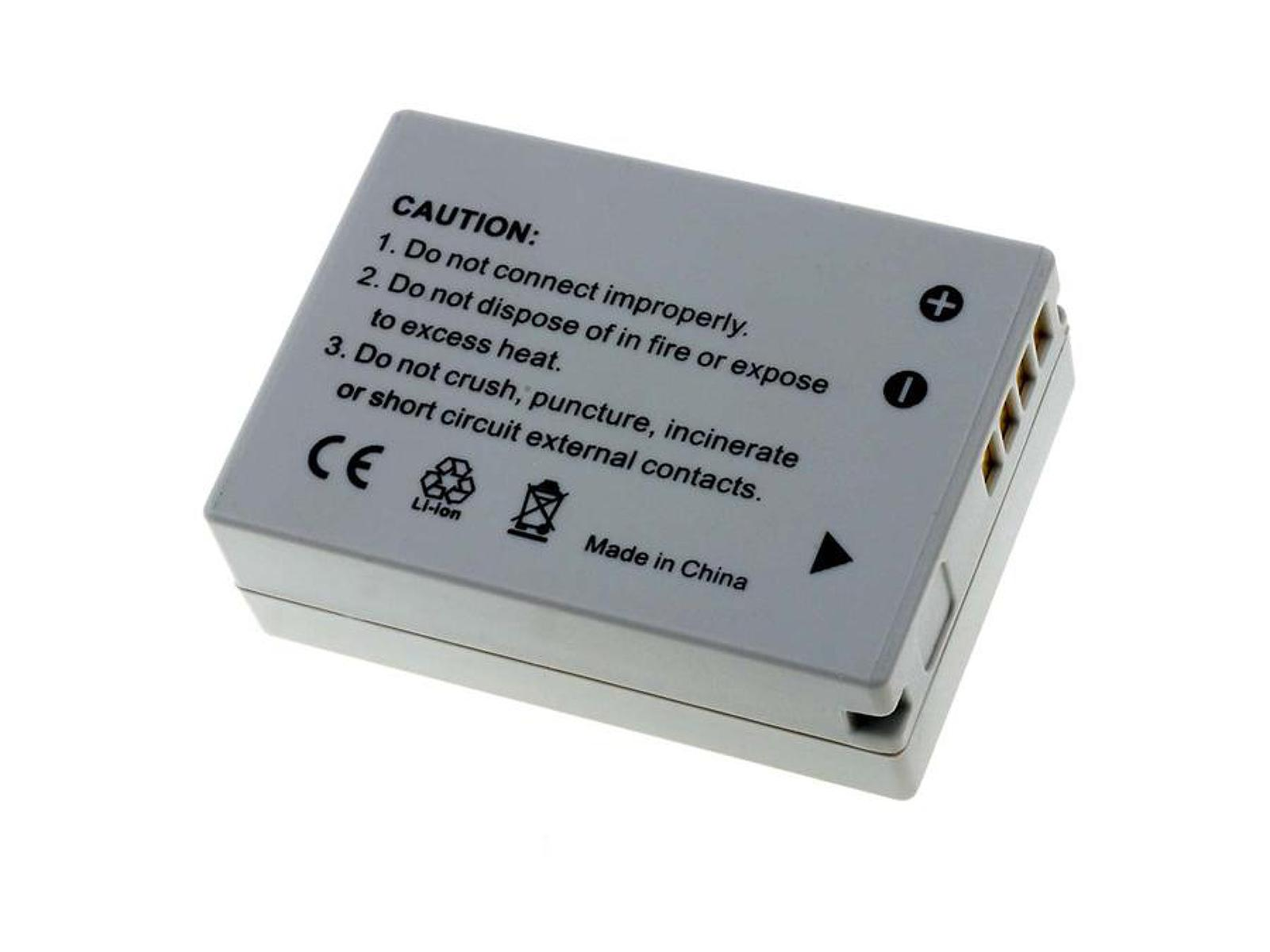 Batería gris con texto de precaución y símbolos. Signos más y menos, y un conector.