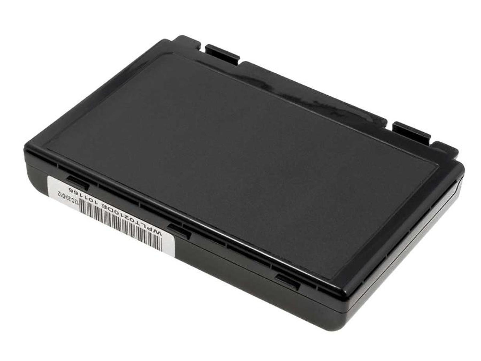 Batería de portátil negra y rectangular. Etiqueta blanca con texto.