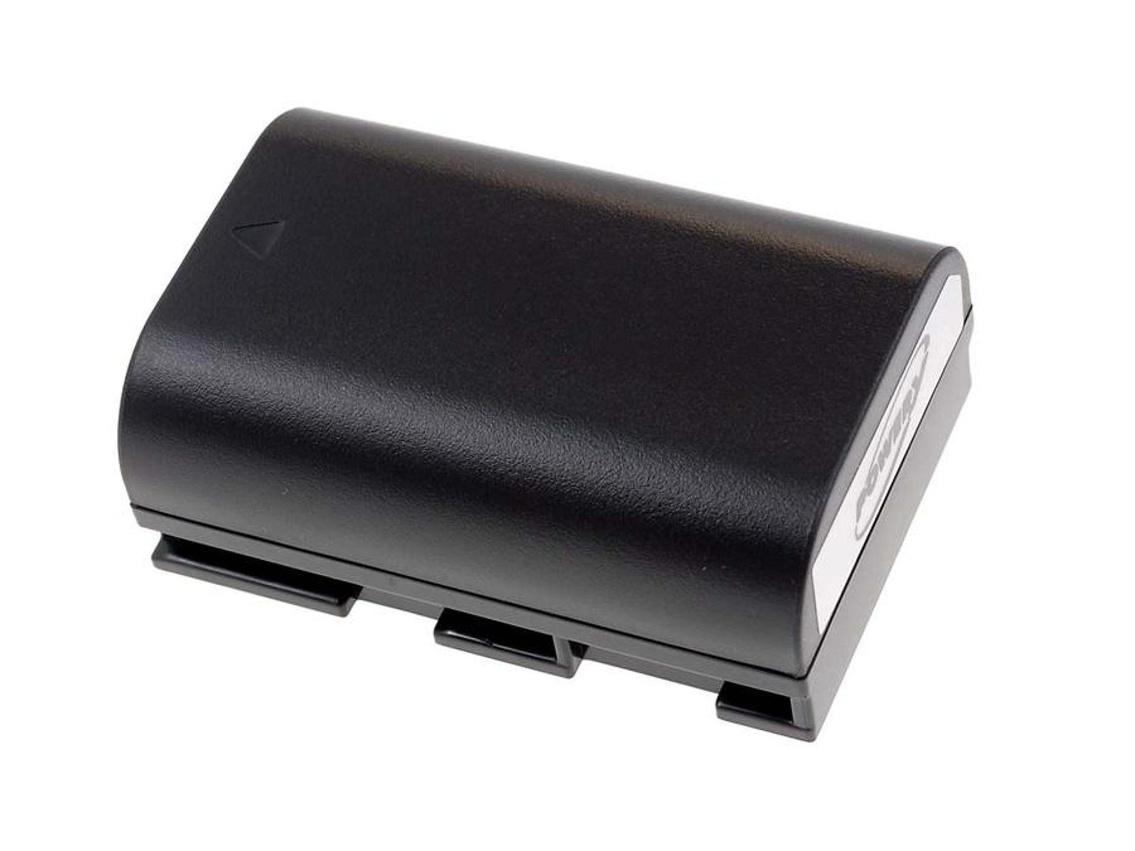 Una batería negra rectangular con etiqueta, sobre una superficie blanca.