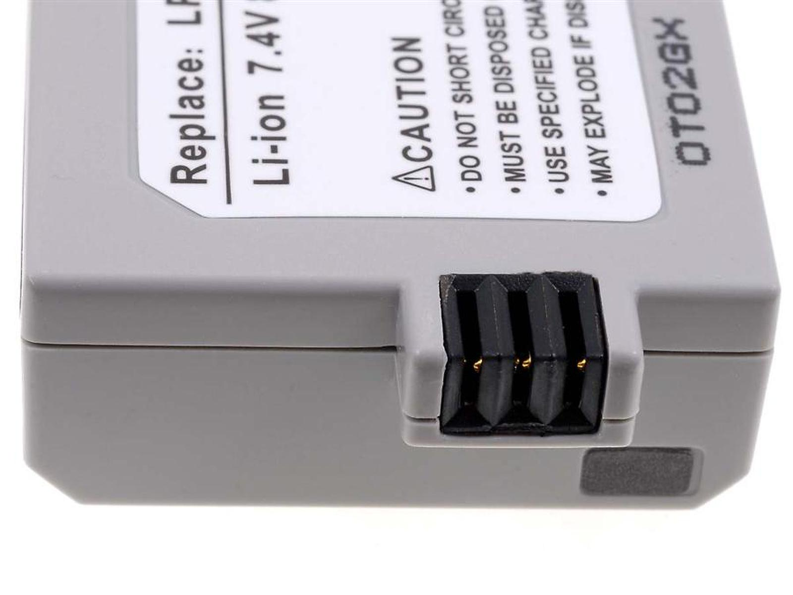 Primer plano de una batería gris con un conector negro y una etiqueta blanca con texto.