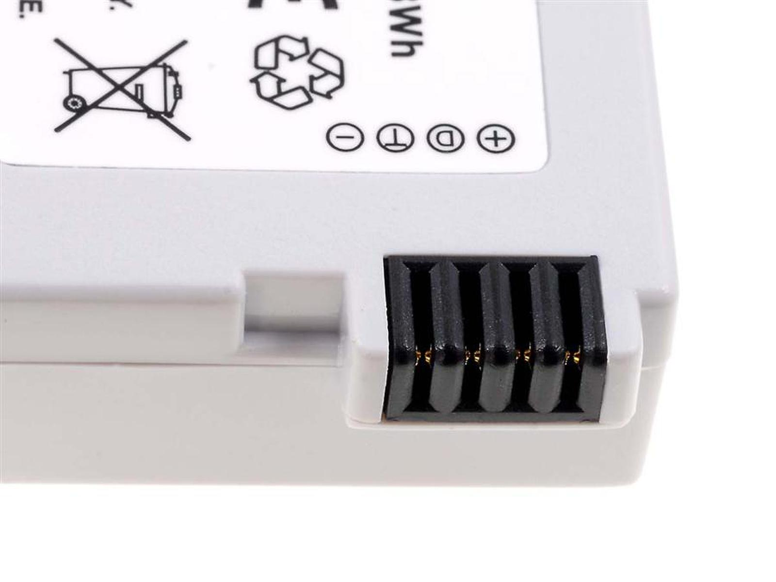 Conector de batería blanco con contactos negros y símbolos.