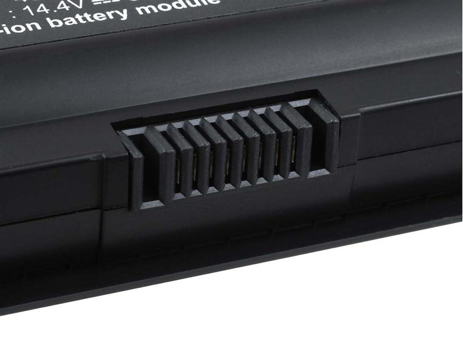 Primer plano de una batería negra para portátil con un conector, que muestra los puntos de contacto.