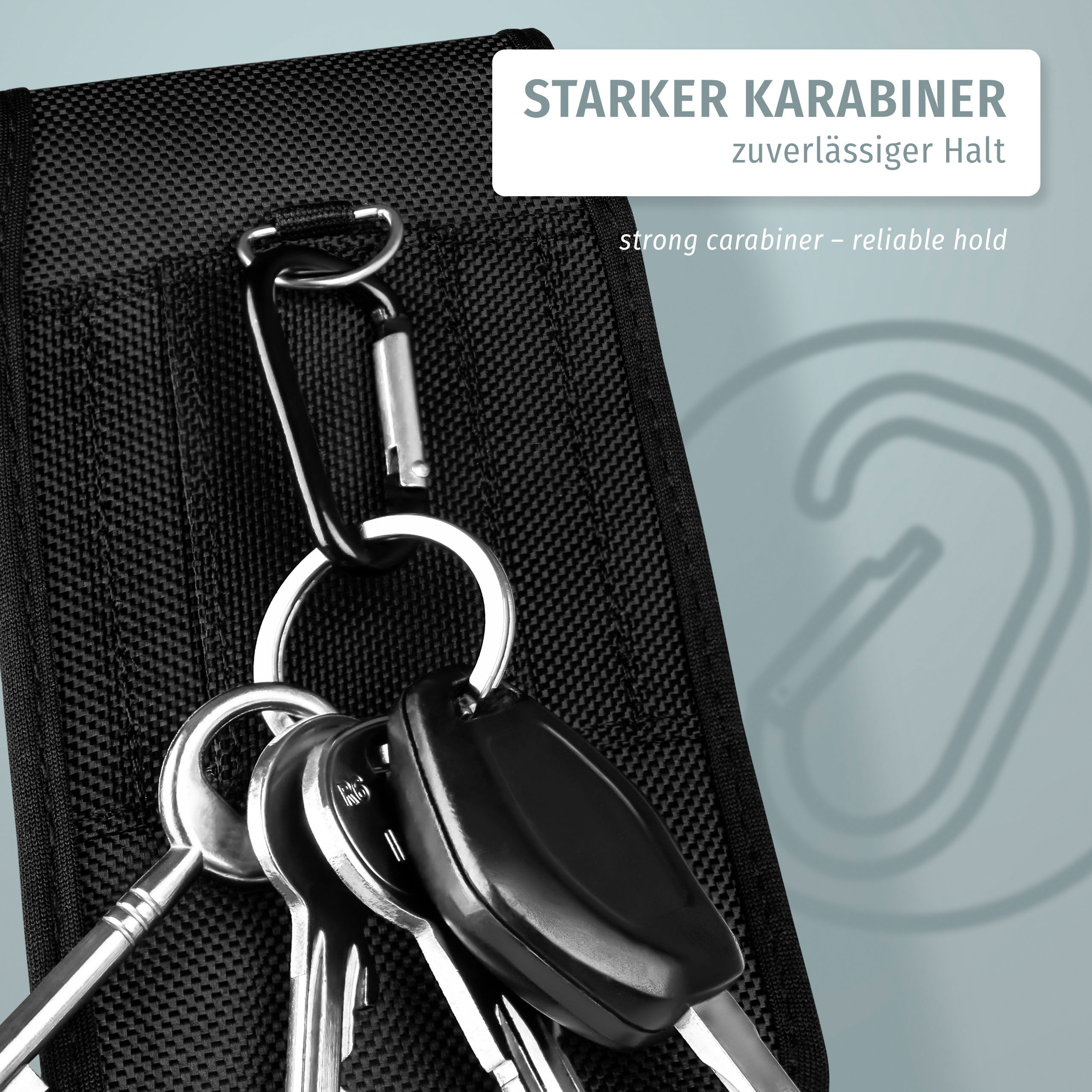 Schlüssel und ein Karabiner an einem schwarzen Gegenstand befestigt. Text: starker Karabiner.