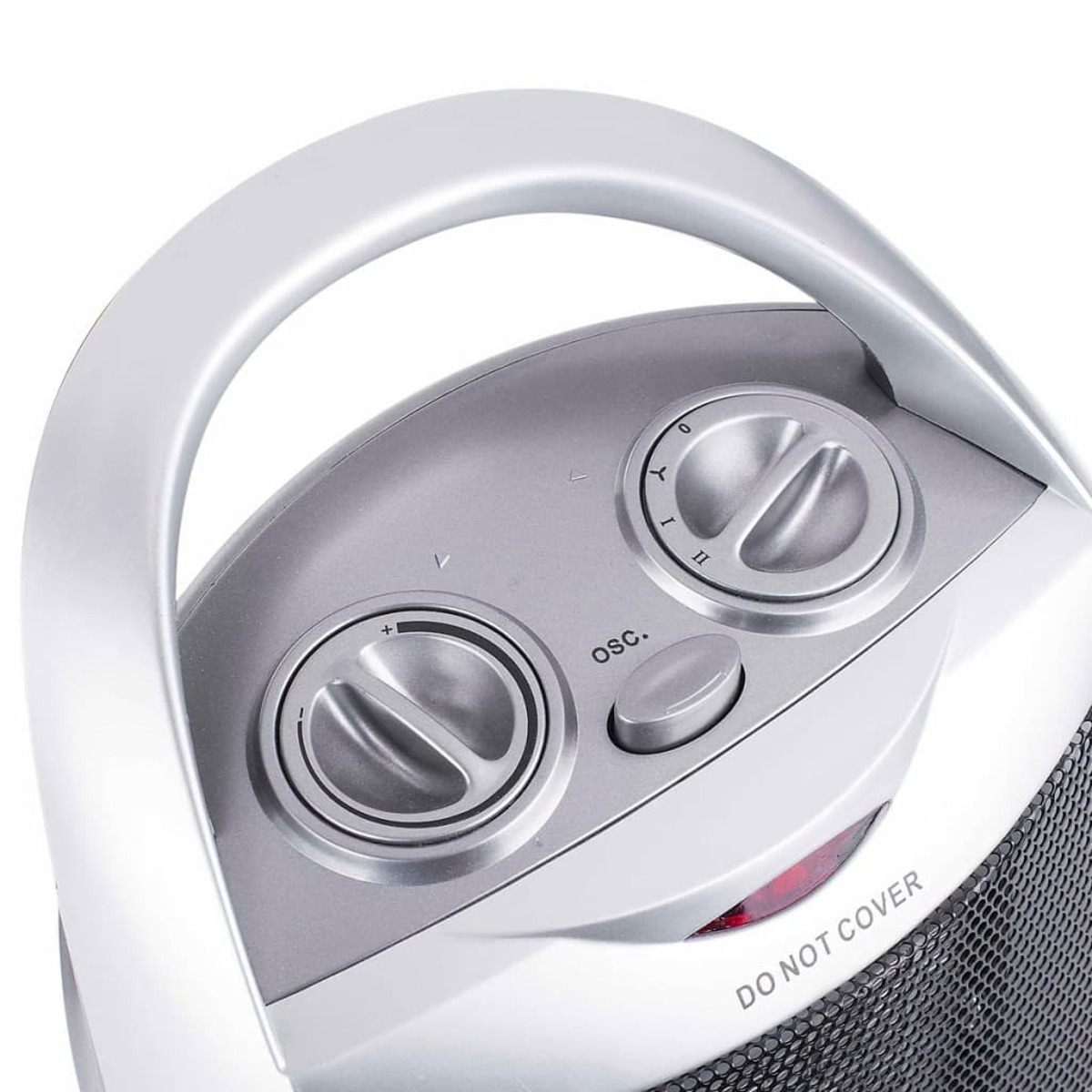 Panneau de commande de chauffage argenté et gris avec des boutons. Texte 'DO NOT COVER' visible.