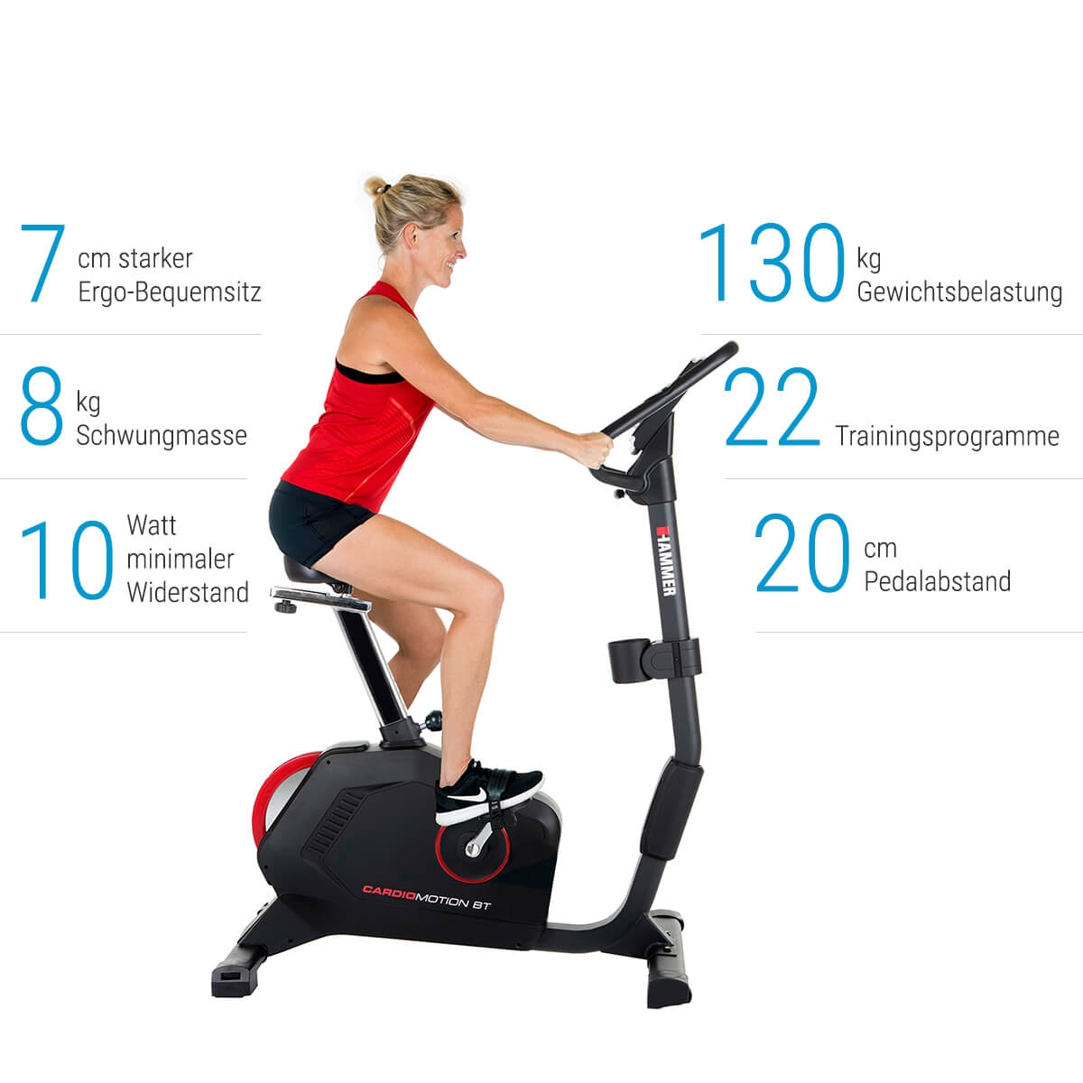 Frau auf einem Heimtrainer mit Daten: 7cm Sitz, 8kg Schwungrad, 10 Watt Widerstand.