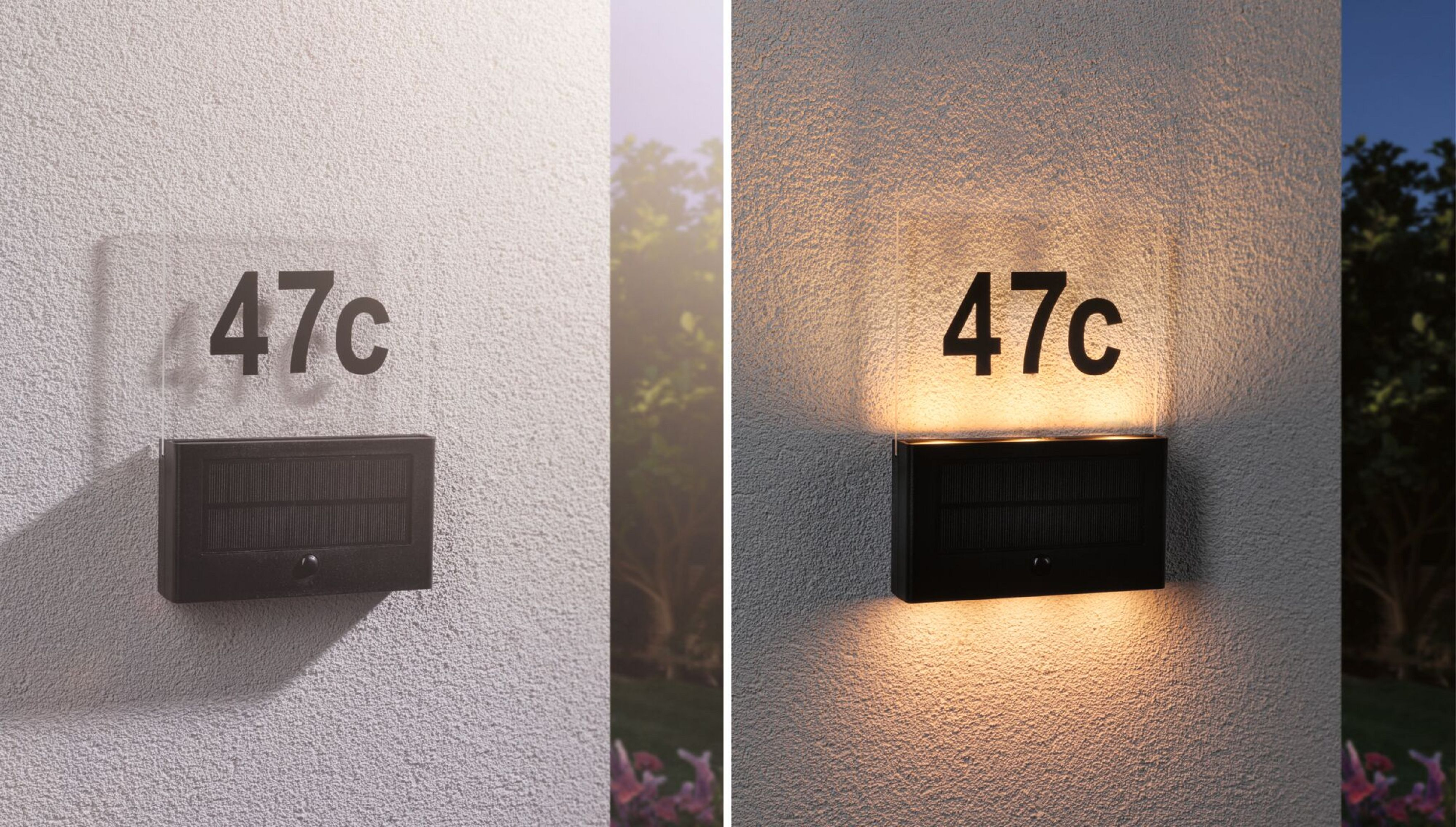 Ein schwarzes Adressschild mit der Nummer 47c ist an einer Wand angebracht. Die Plakette wird beleuchtet.