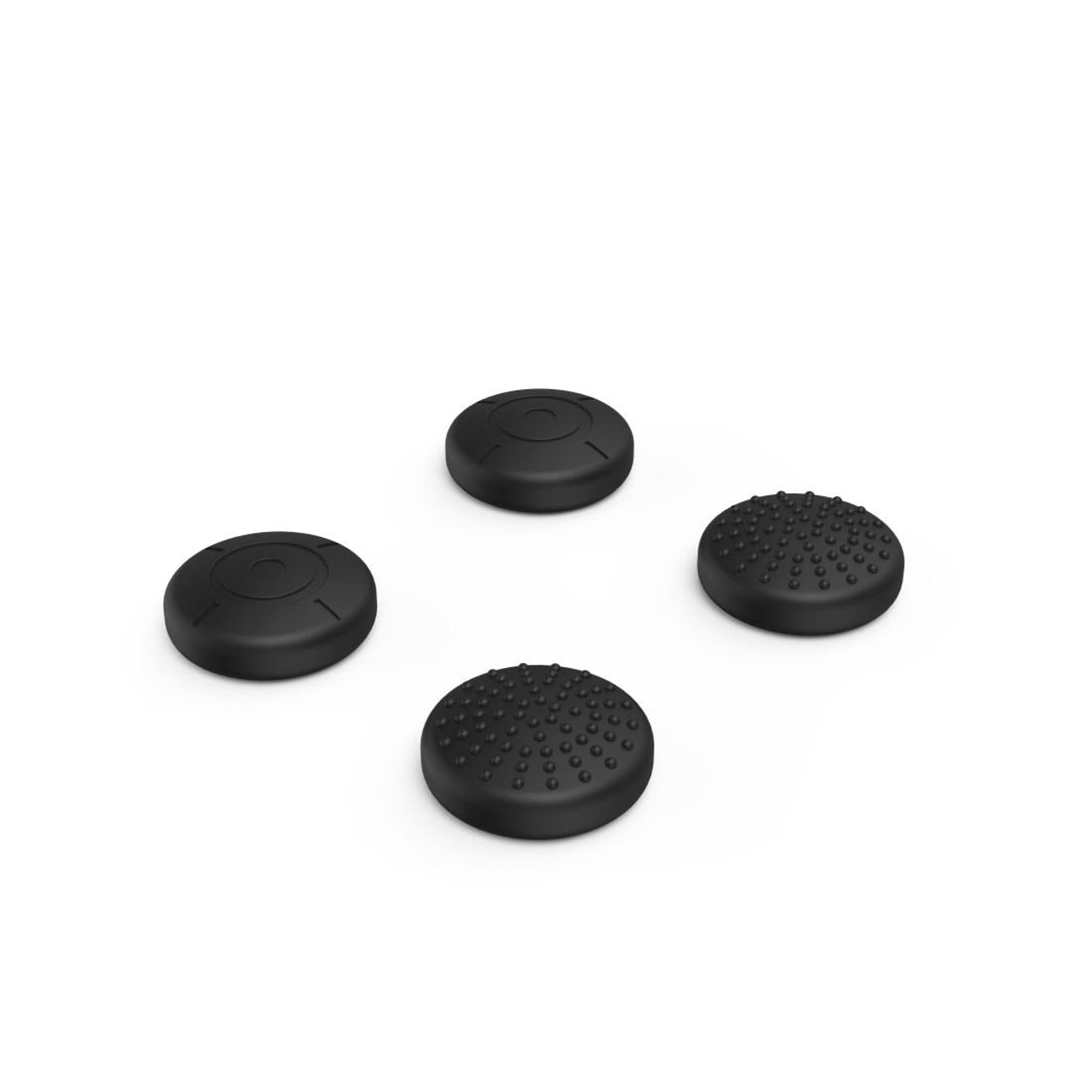Vier schwarze Joystick-Daumengriffe auf weißem Hintergrund. Sie haben unterschiedliche Texturen.