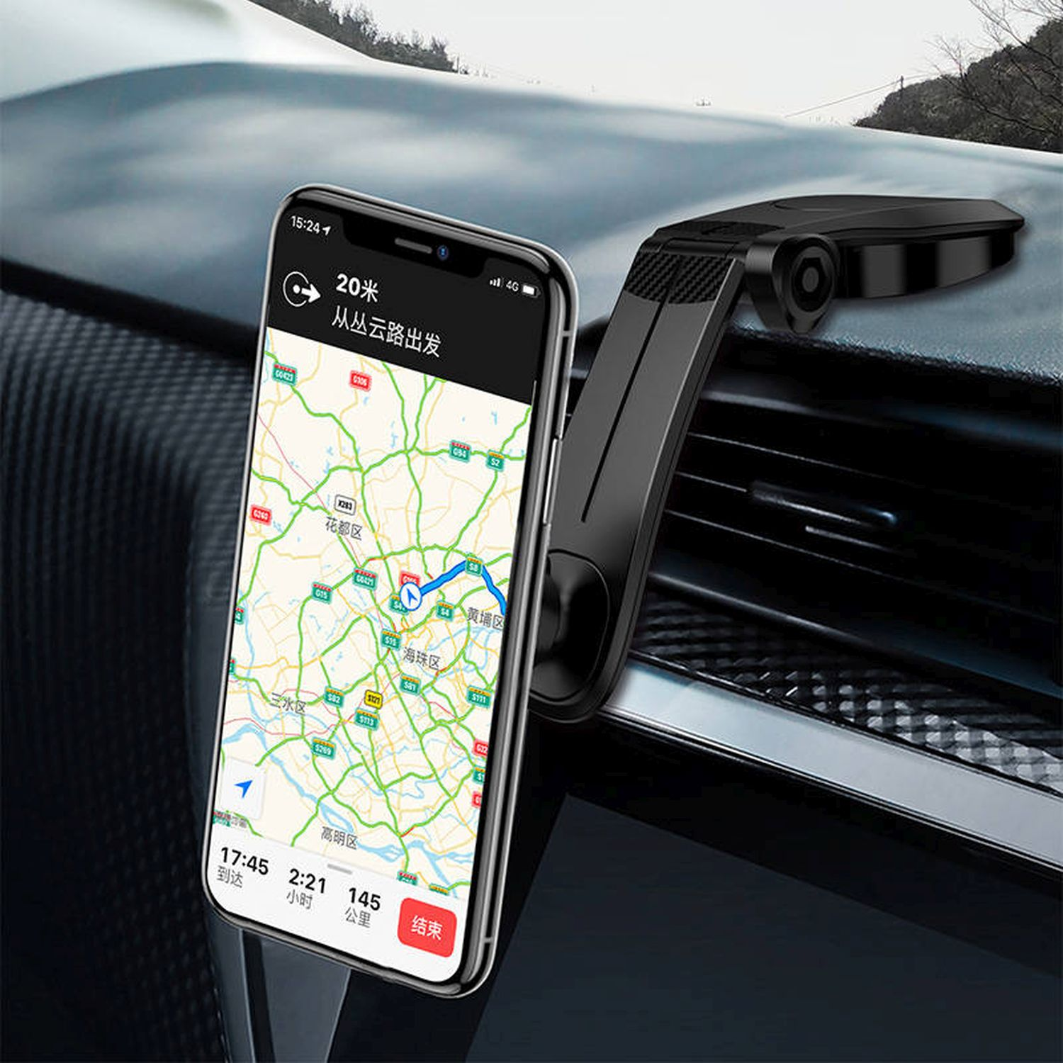 Schwarzes Telefon mit Navigations-App auf dem Bildschirm, montiert auf dem Armaturenbrett.