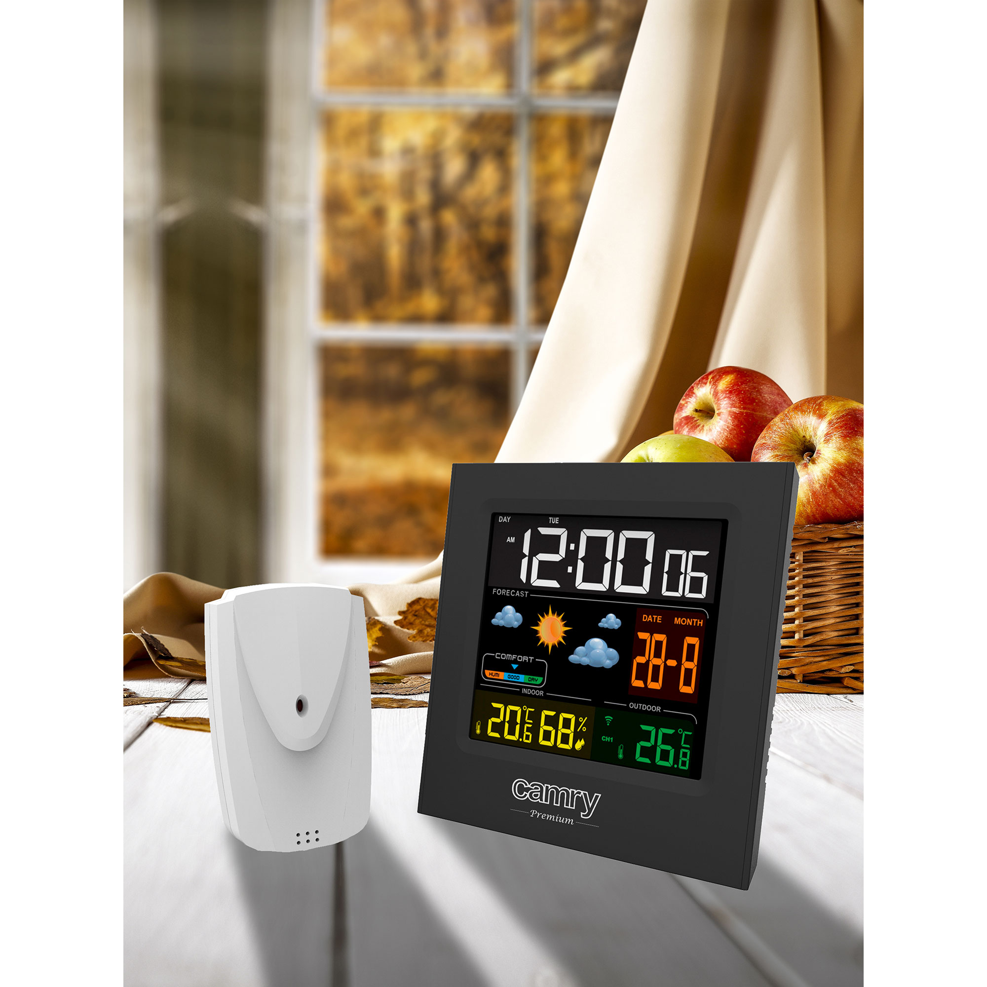 Czarna stacja pogodowa z wyświetlaczem pokazującym godzinę, datę i dane pogodowe.