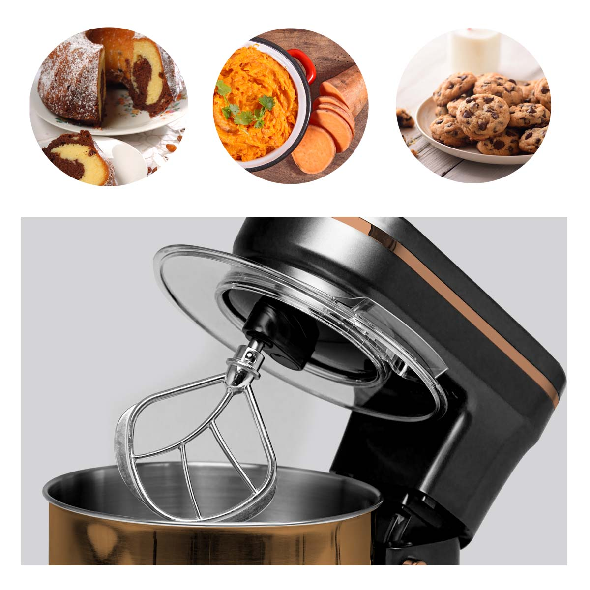 Stand mixer with bowl and whisk, with cupcakes and cake in the background.