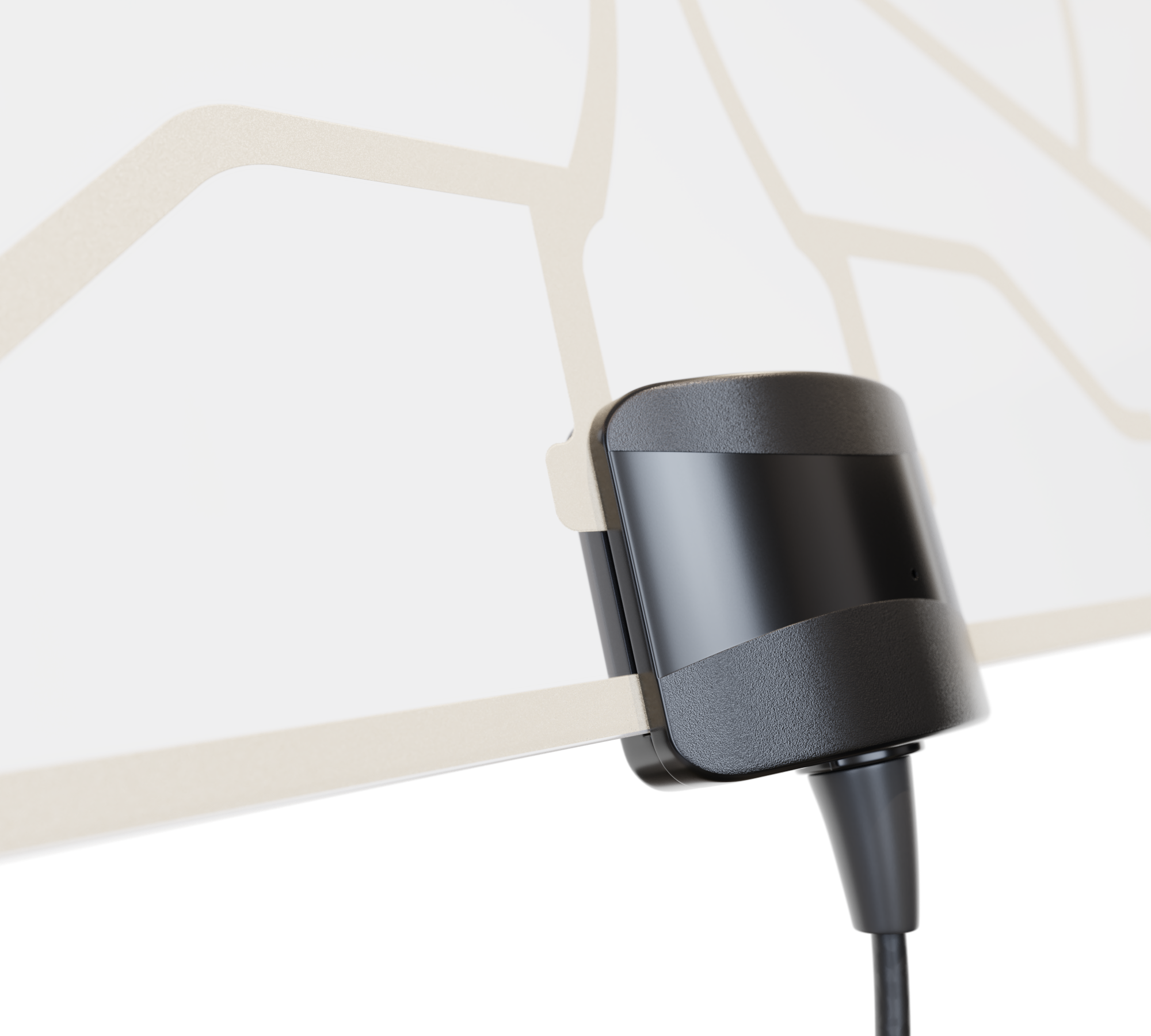 Schwarzes Gerät mit Kabel, an einer weißen Kartenumrisslinie auf schwarzem Hintergrund befestigt.