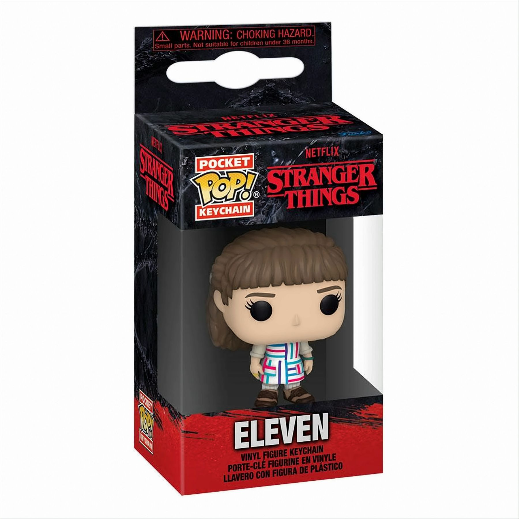 Un portachiavi di Eleven di Stranger Things in una scatola, una figura con giacca colorata.