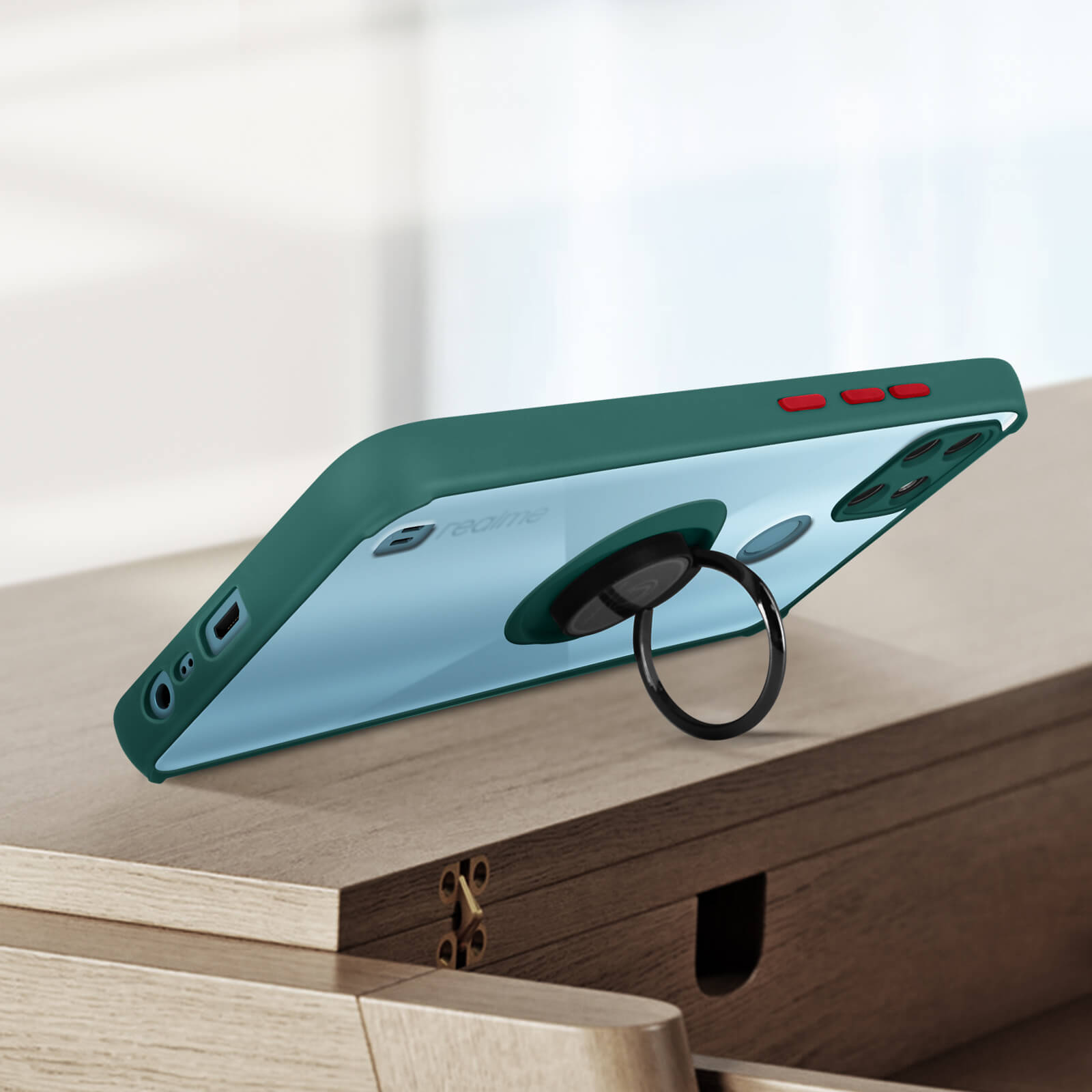 Una custodia verde per telefono con retro trasparente, supporto ad anello nero e pulsanti rossi.