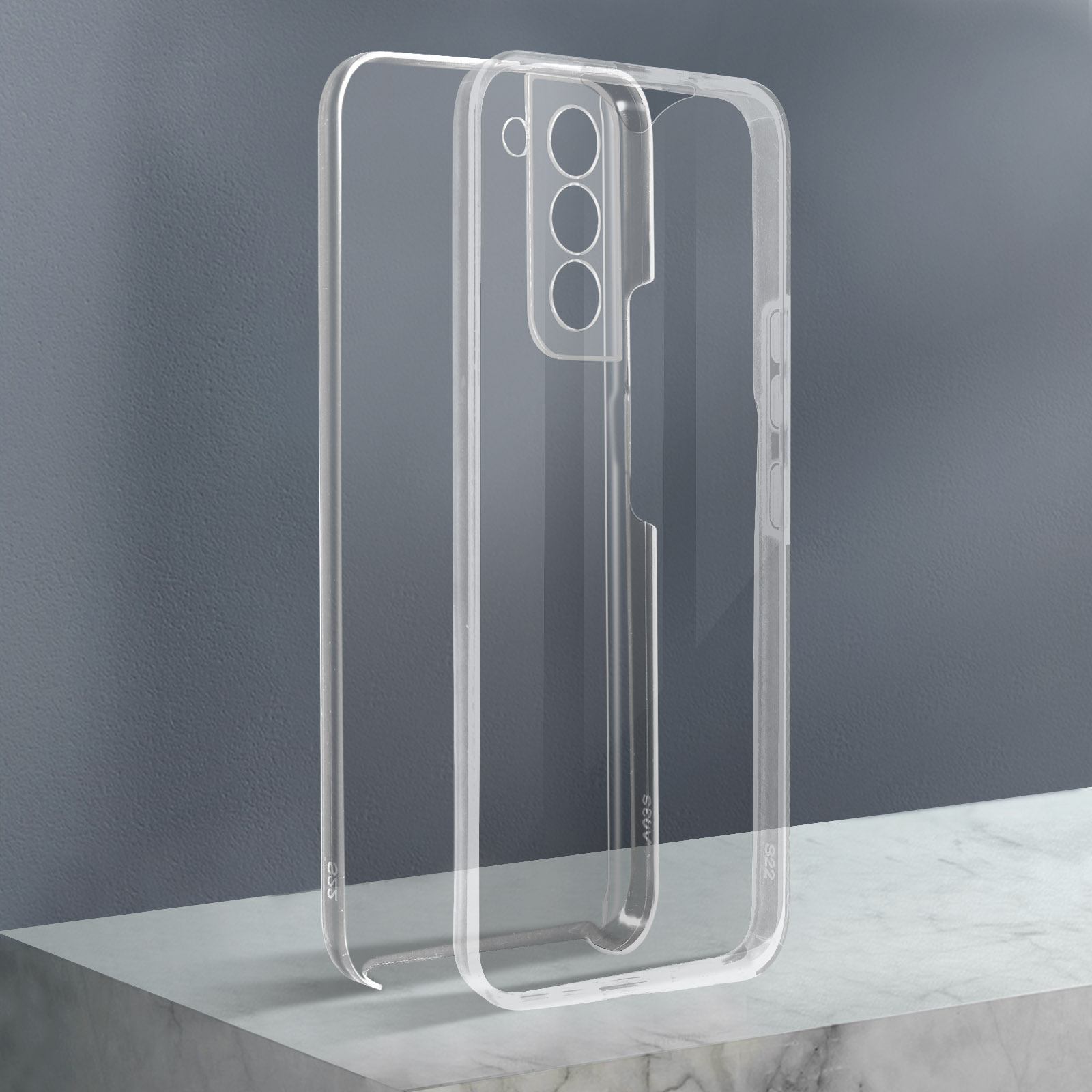 Due custodie trasparenti per telefono affiancate su una superficie grigia. Le custodie hanno un design minimalista.