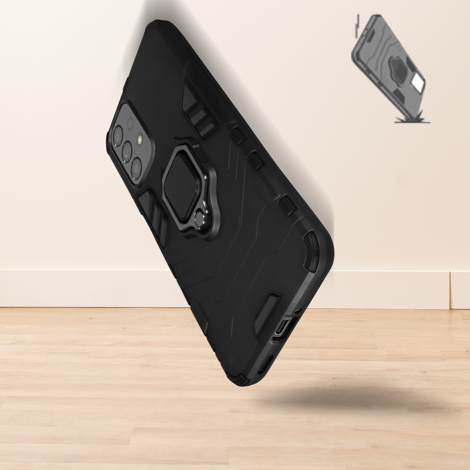 Custodia per telefono nera con anello, appoggiata su una superficie in legno, un'altra custodia che cade.