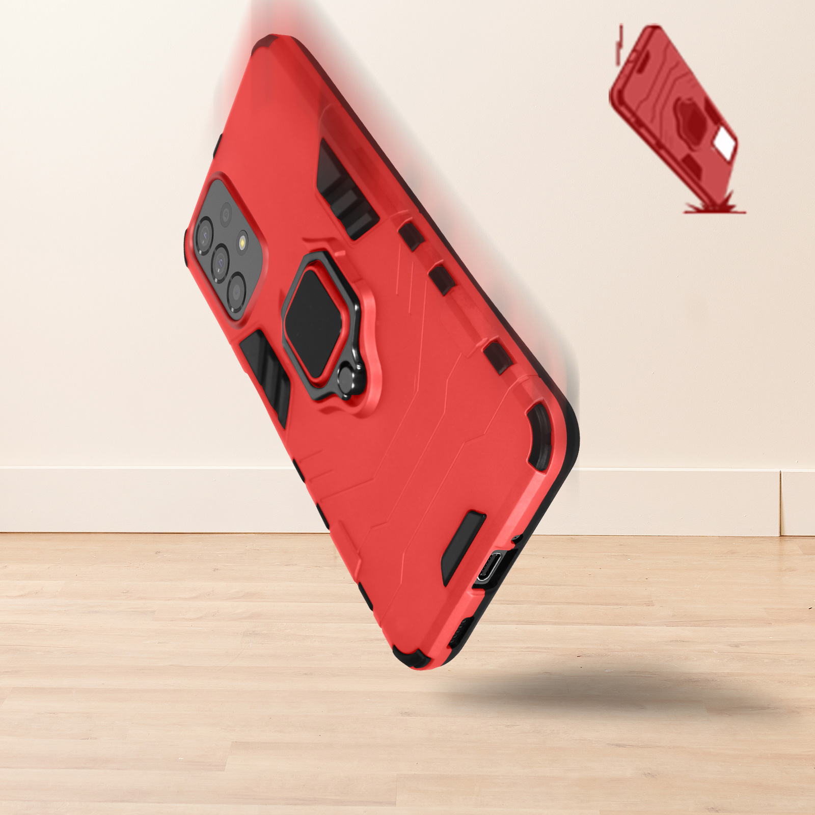 Custodia rossa per telefono che cade, dettagli neri, anello di supporto. Un'altra custodia sullo sfondo.