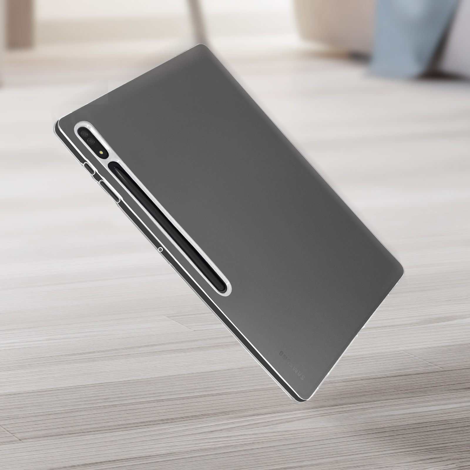 Graues Tablet auf Holzoberfläche. Das Tablet ist leicht geneigt. Hintergrund ist unscharf.