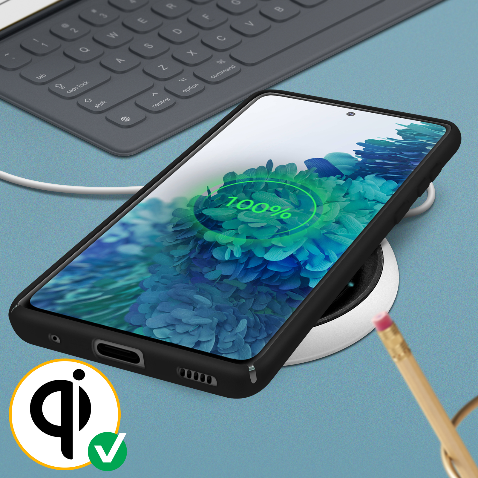 Un téléphone se charge sans fil sur un socle de chargement. Affiche 100%.