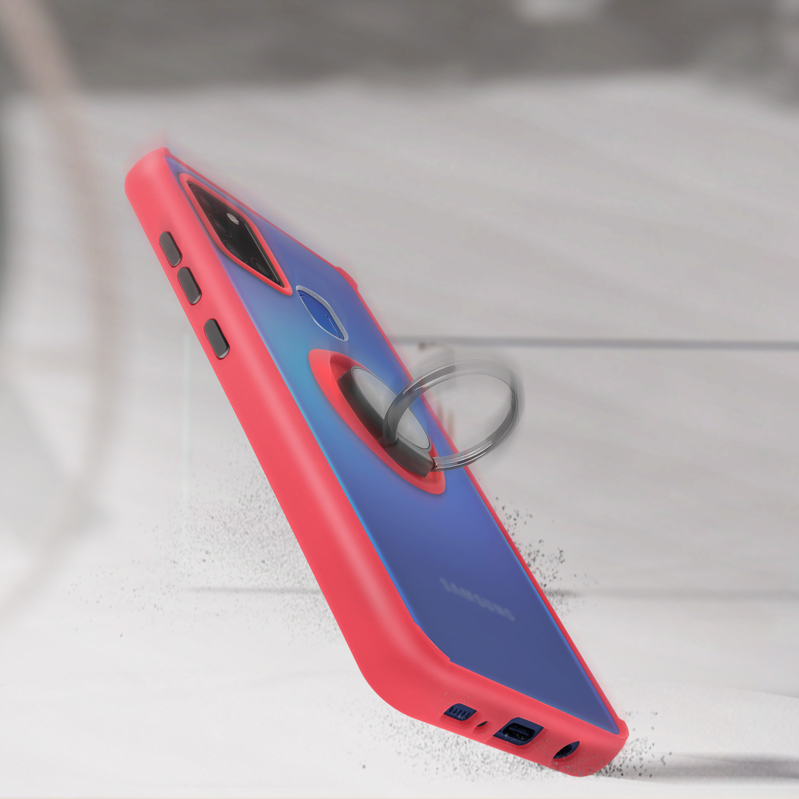 Une coque de téléphone rouge et bleue avec un support d'anneau, en angle sur une surface claire, avec un arrière-plan flou.