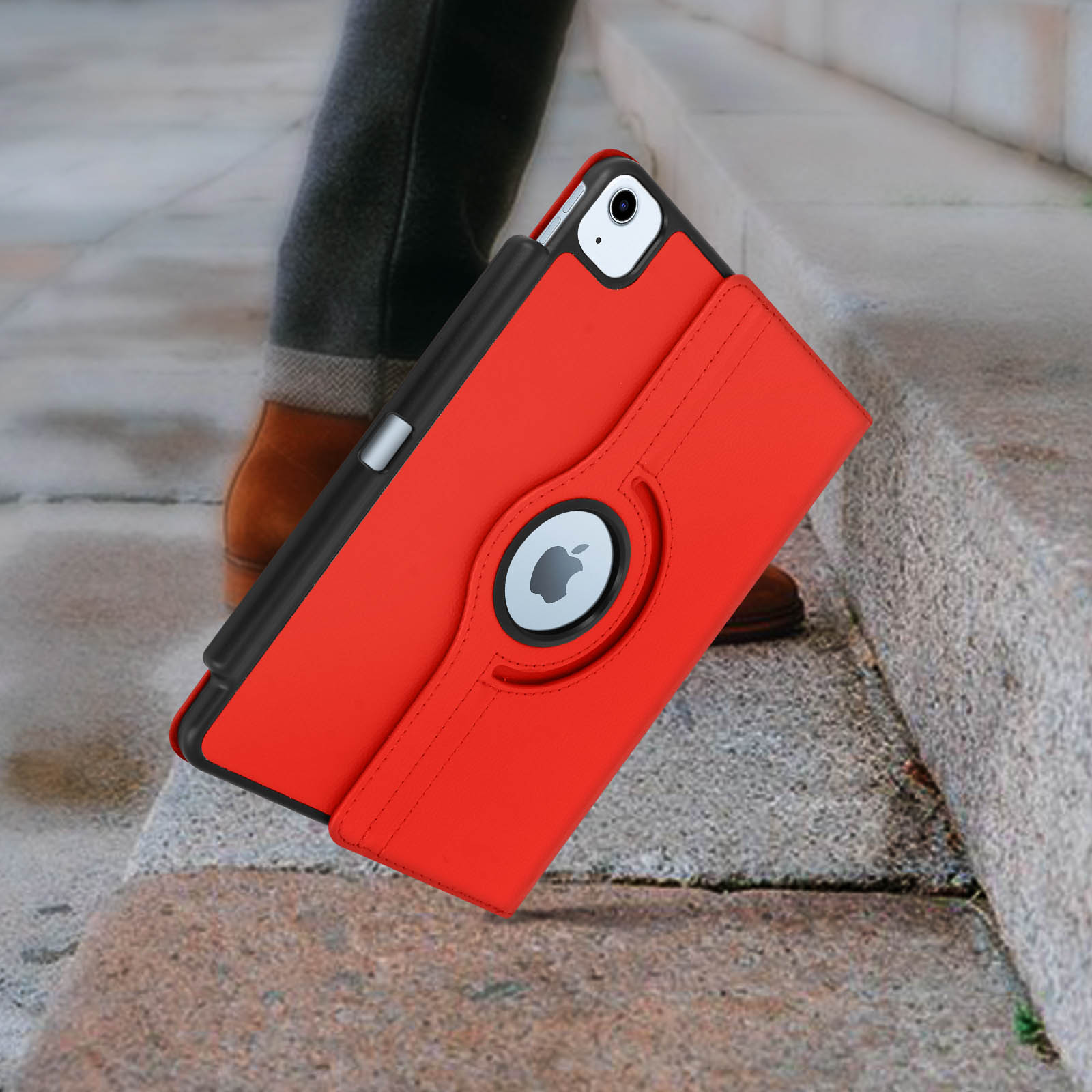 Custodia rossa per tablet su gradini. Gira e logo Apple.