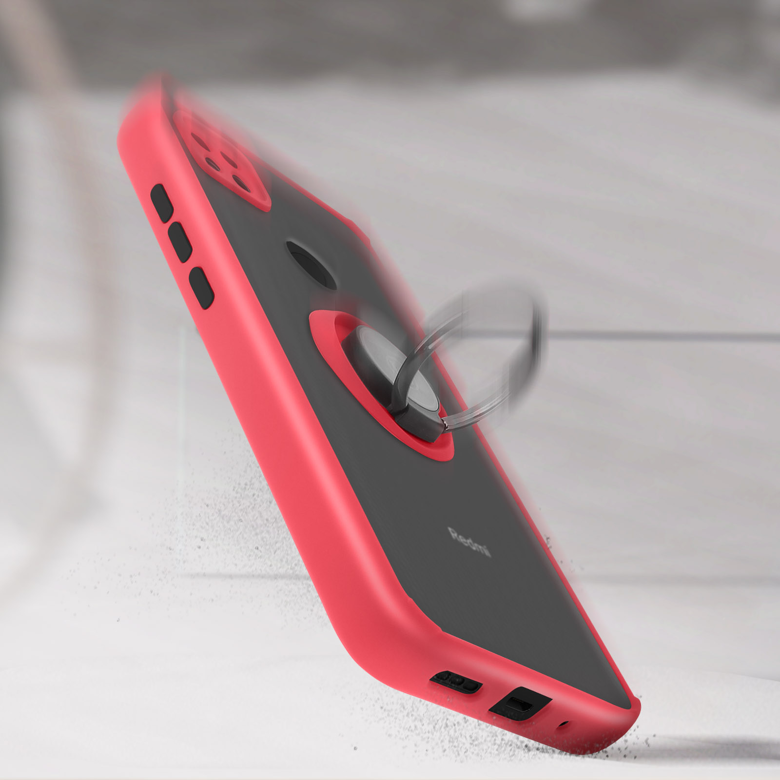 Een rode telefoonhoes met een ringhouder. Op een grijs, getextureerd oppervlak.