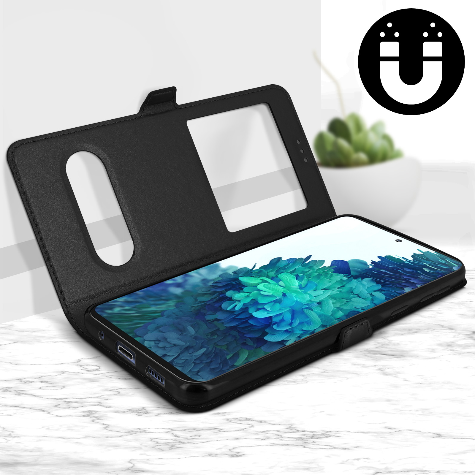 Téléphone noir dans un étui, ouvert pour révéler l'écran. Une petite plante en arrière-plan.