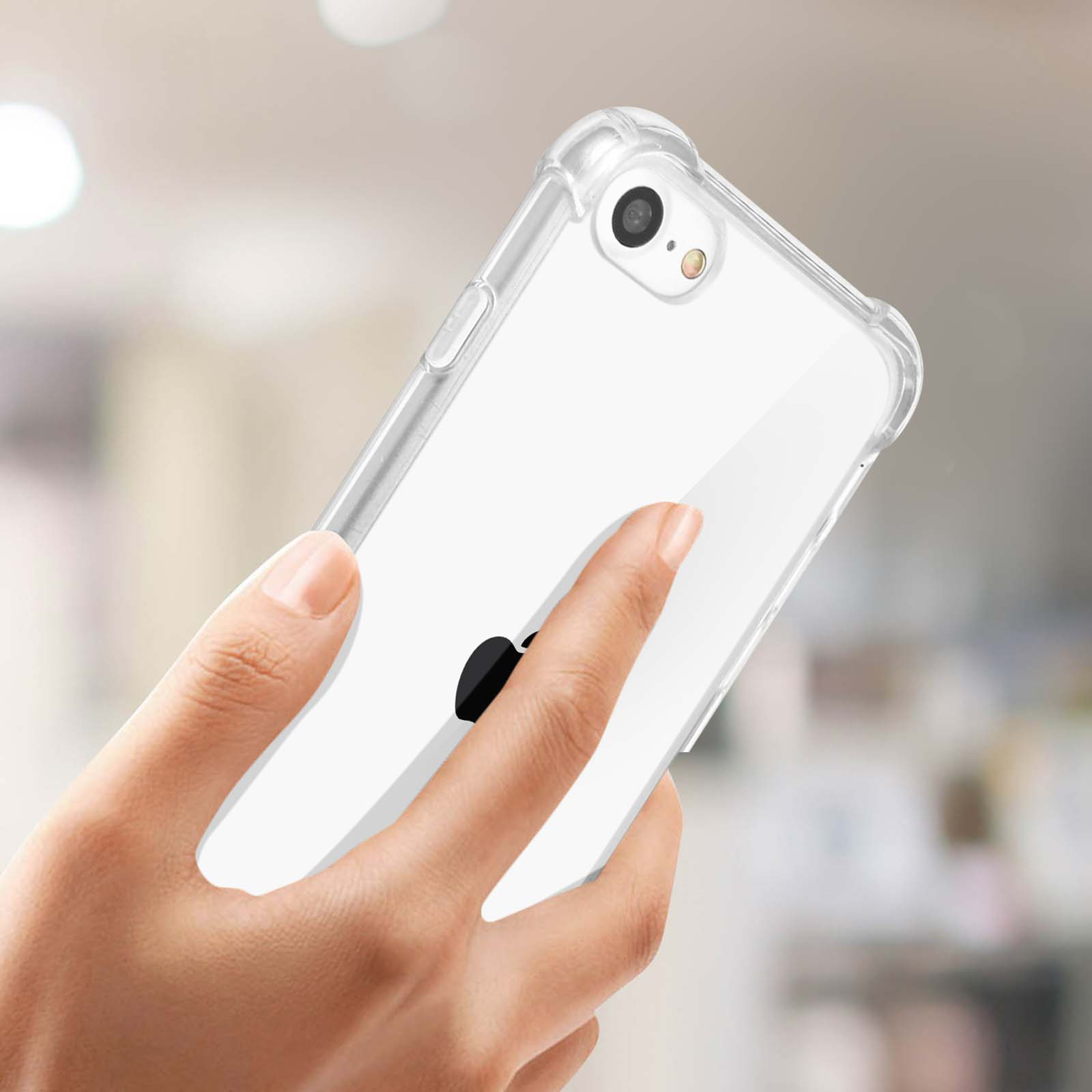 Mano che tiene un telefono trasparente con una custodia. Il telefono ha un logo Apple nero.