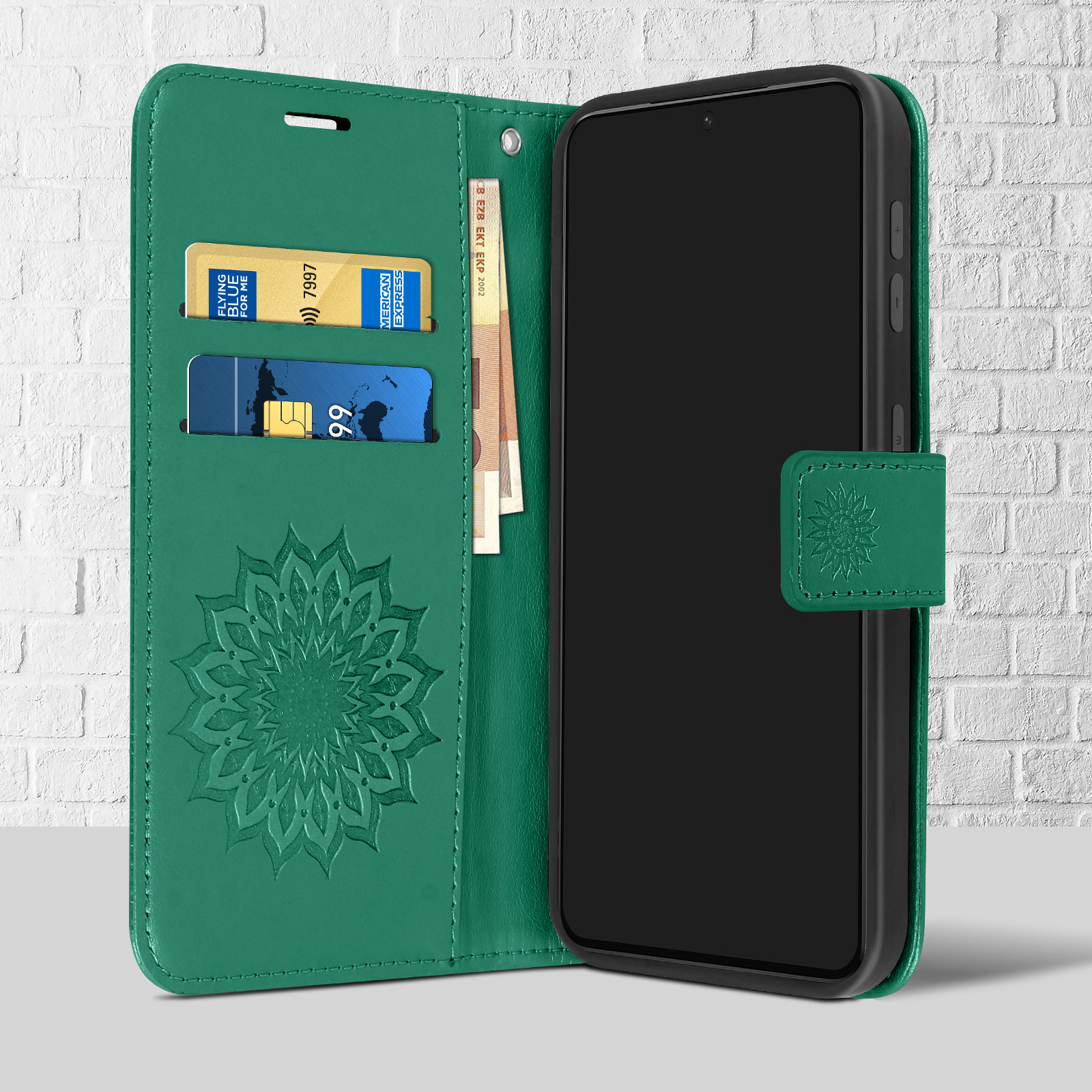 Una custodia a portafoglio verde aperta, che mostra un telefono, carte e denaro.