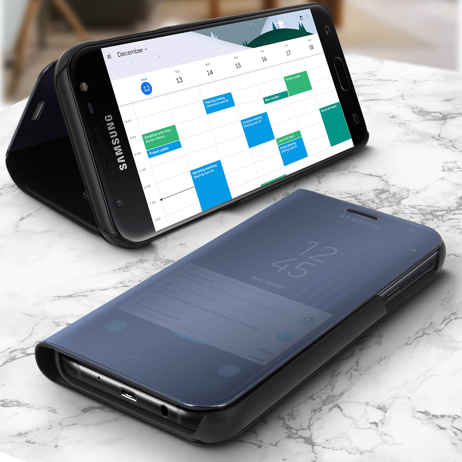 Telefono con app calendario. Custodia aperta. Superficie in marmo.